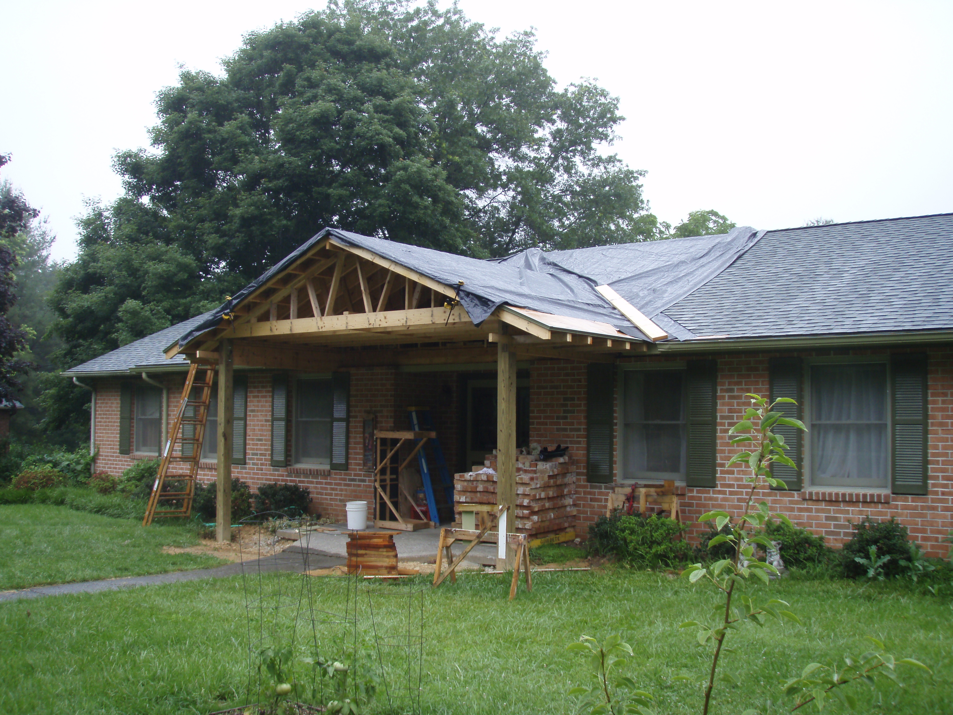 front gable porch with brick raised garden