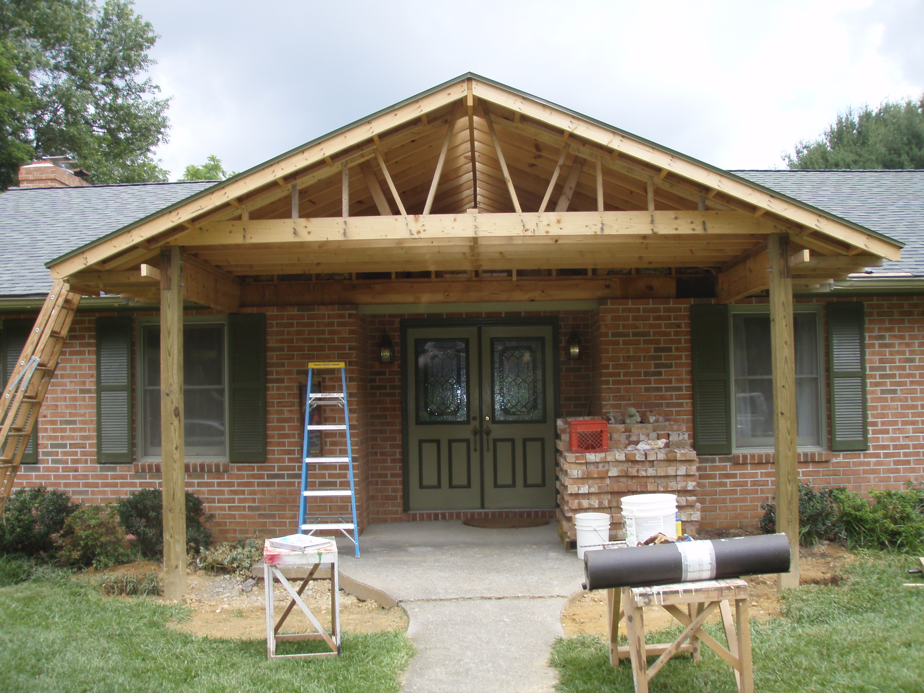 front gable porch with brick raised garden