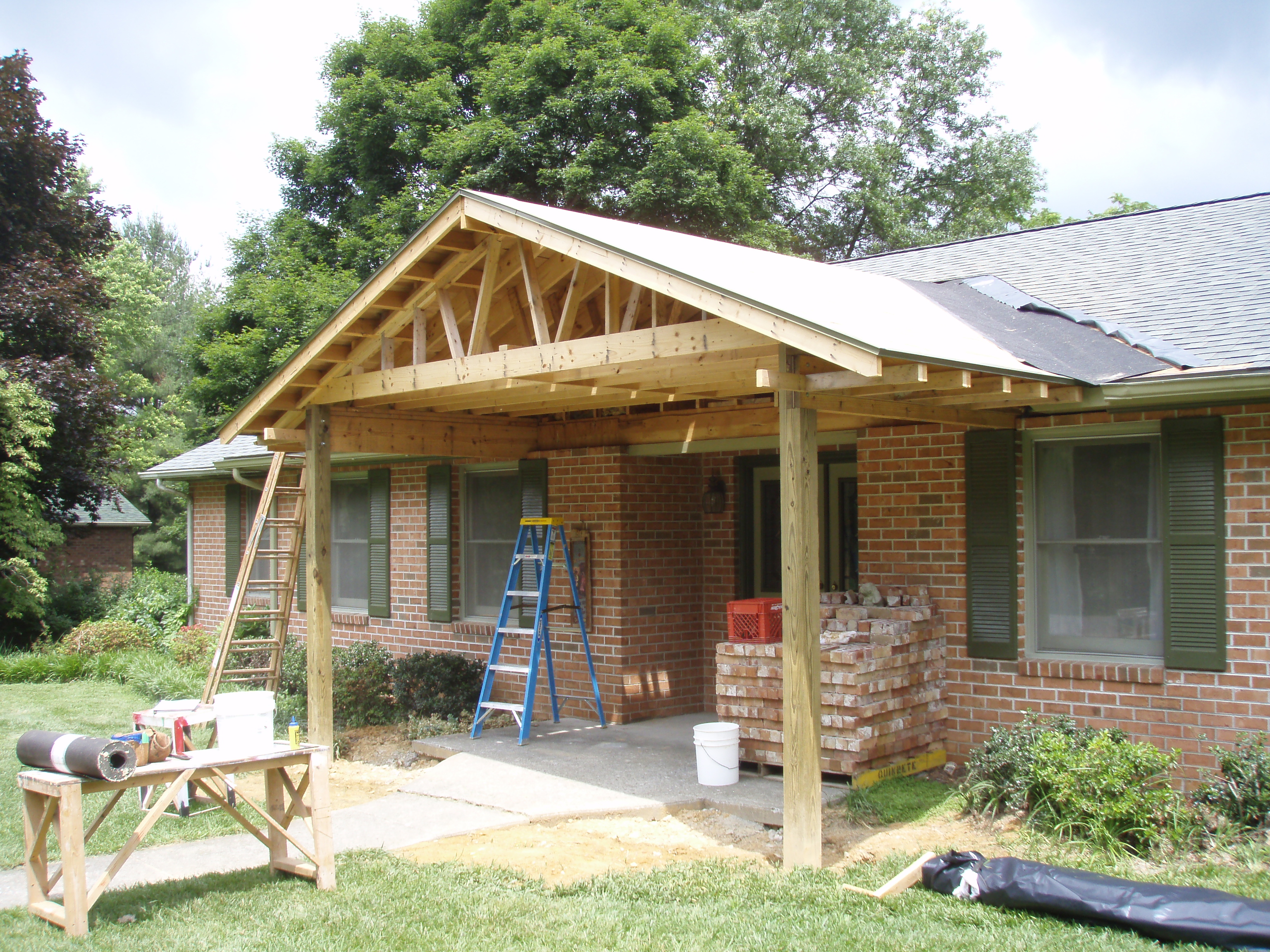 front gable porch with brick raised garden