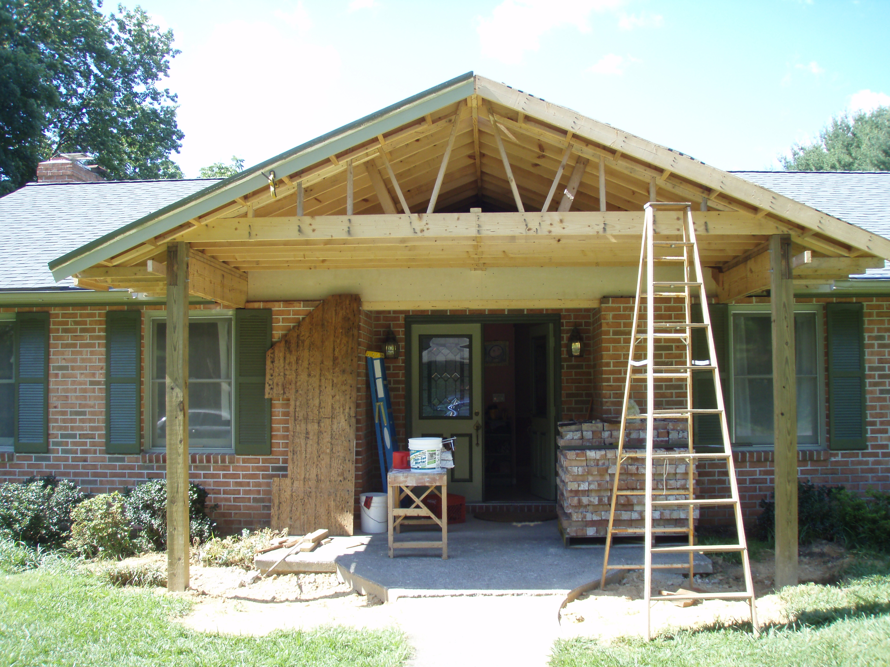 front gable porch with brick raised garden