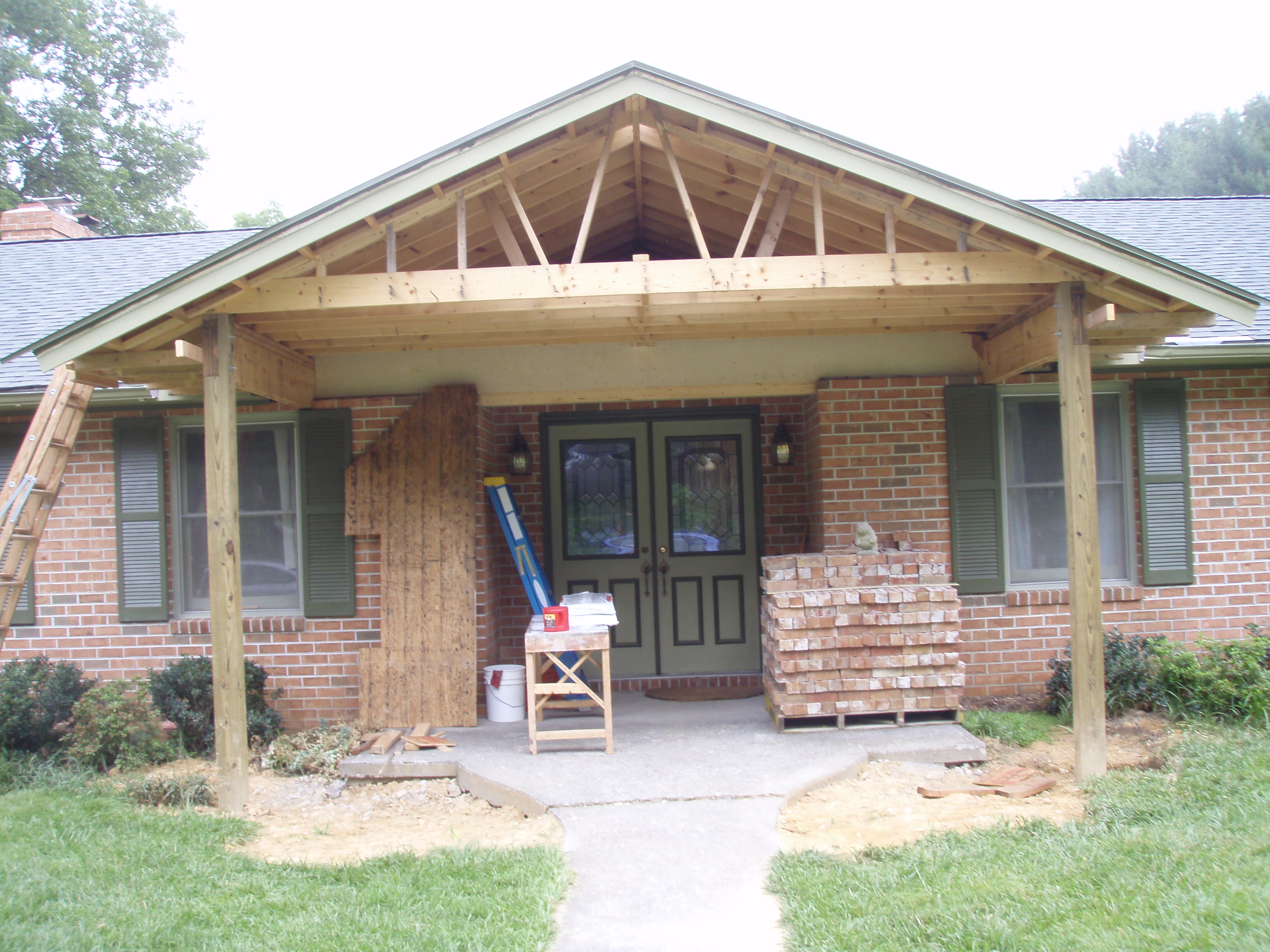 front gable porch with brick raised garden