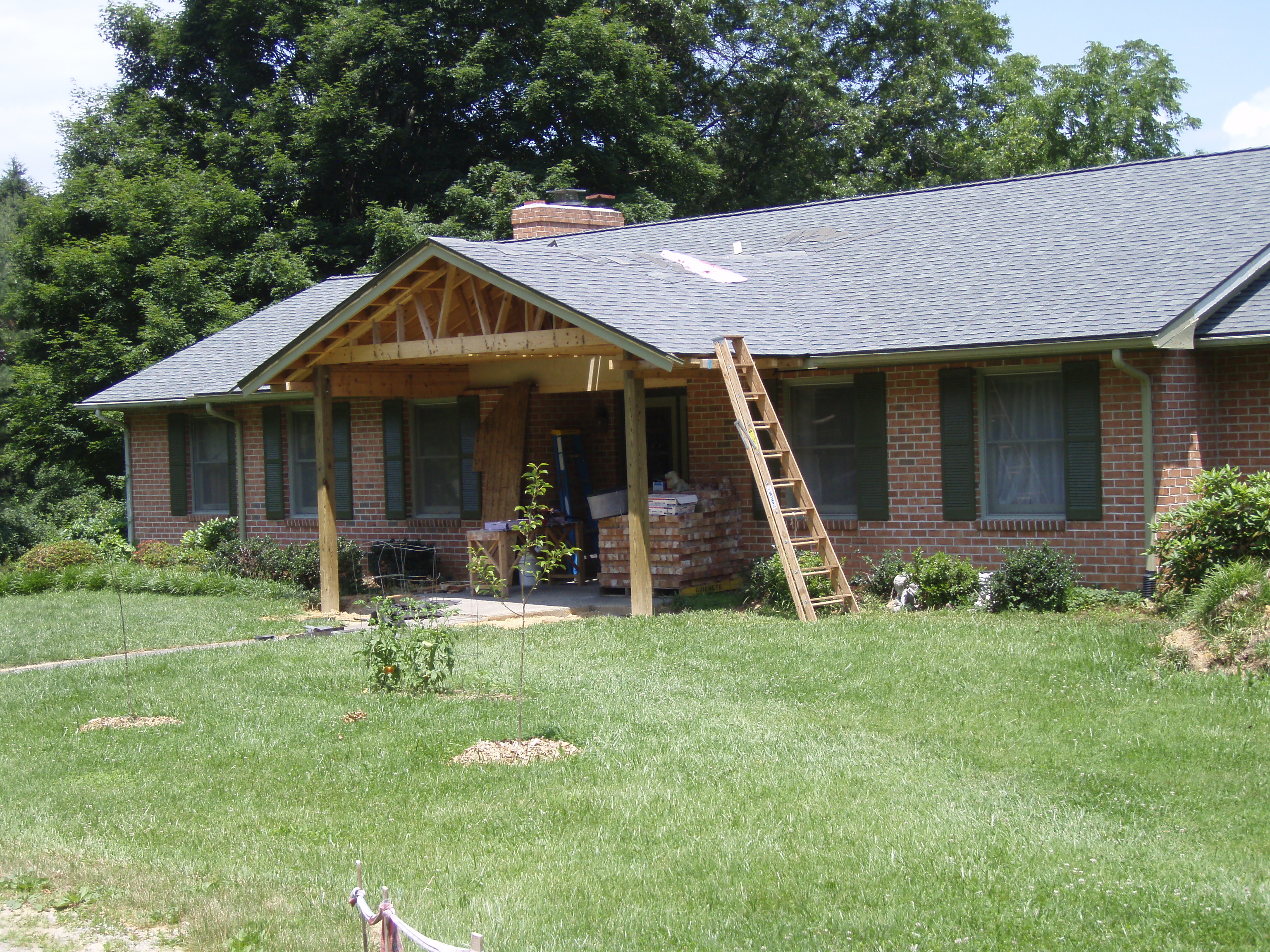 front gable porch with brick raised garden