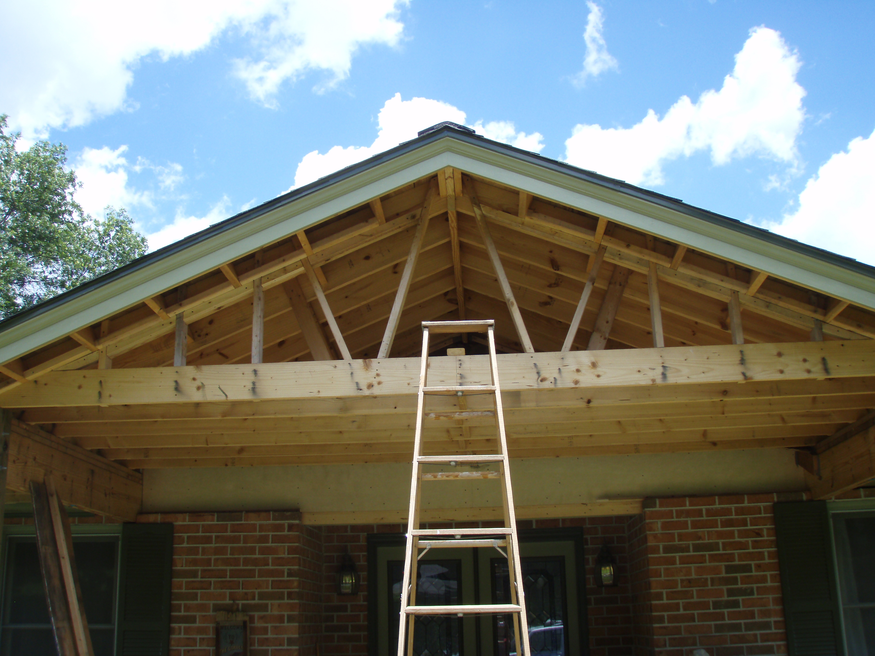 front gable porch with brick raised garden