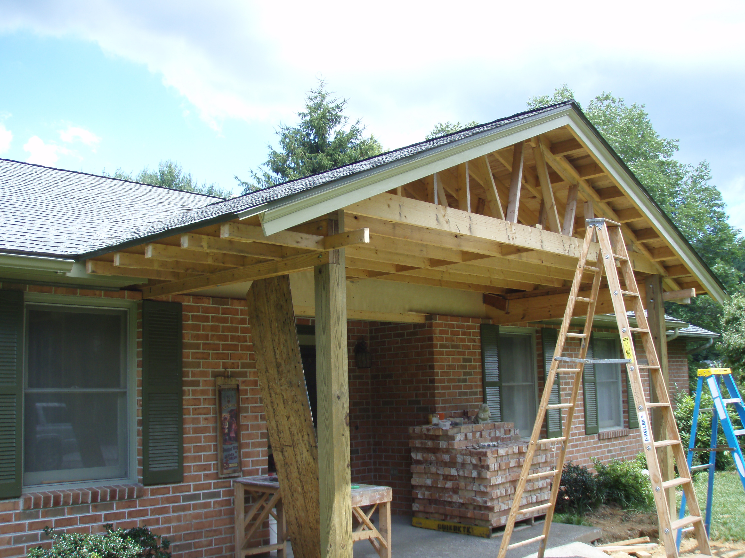 front gable porch with brick raised garden