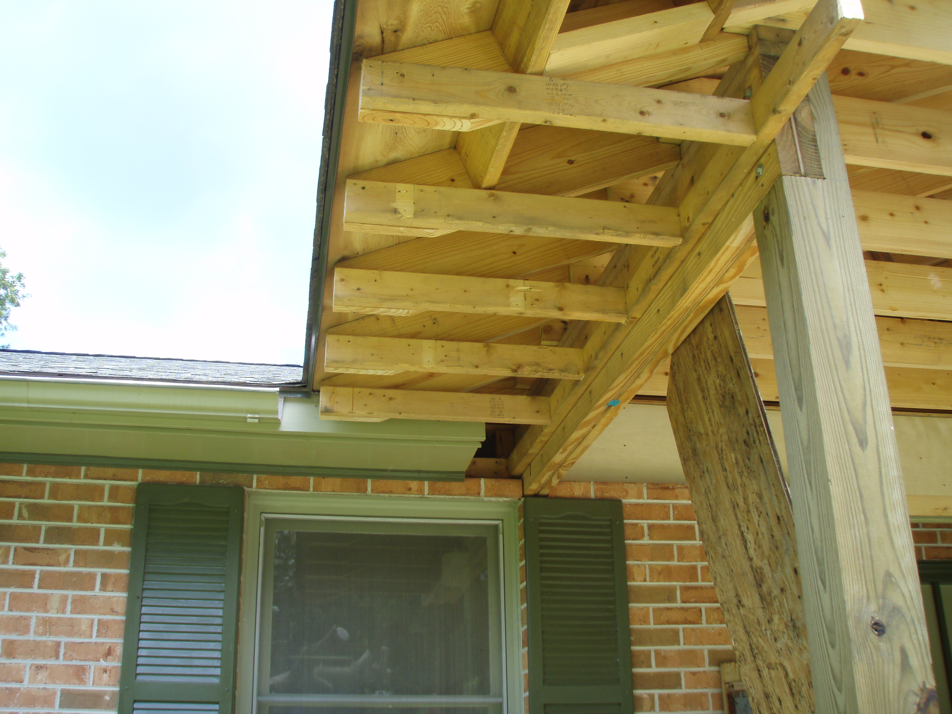 front gable porch with brick raised garden