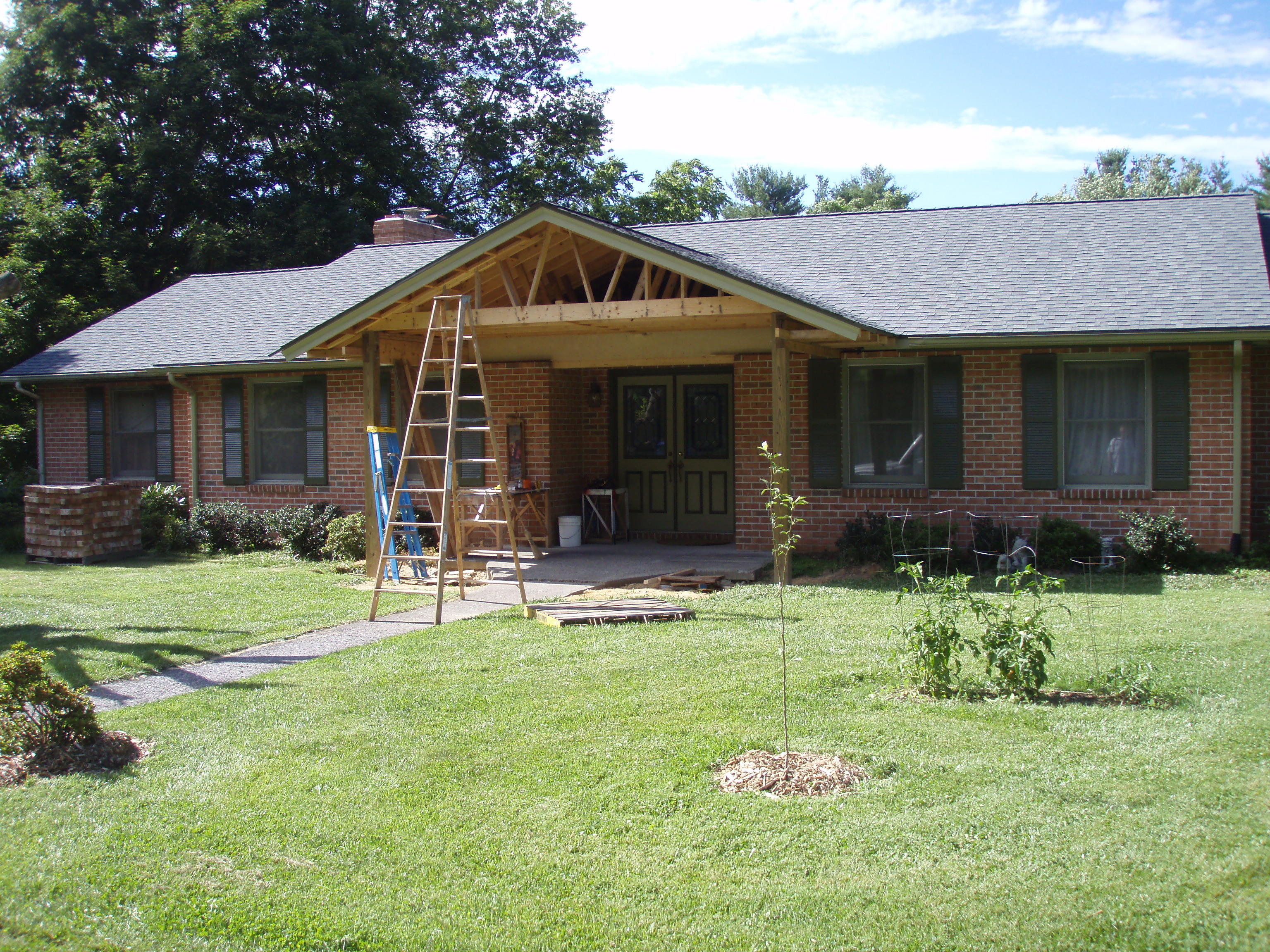 front gable porch with brick raised garden