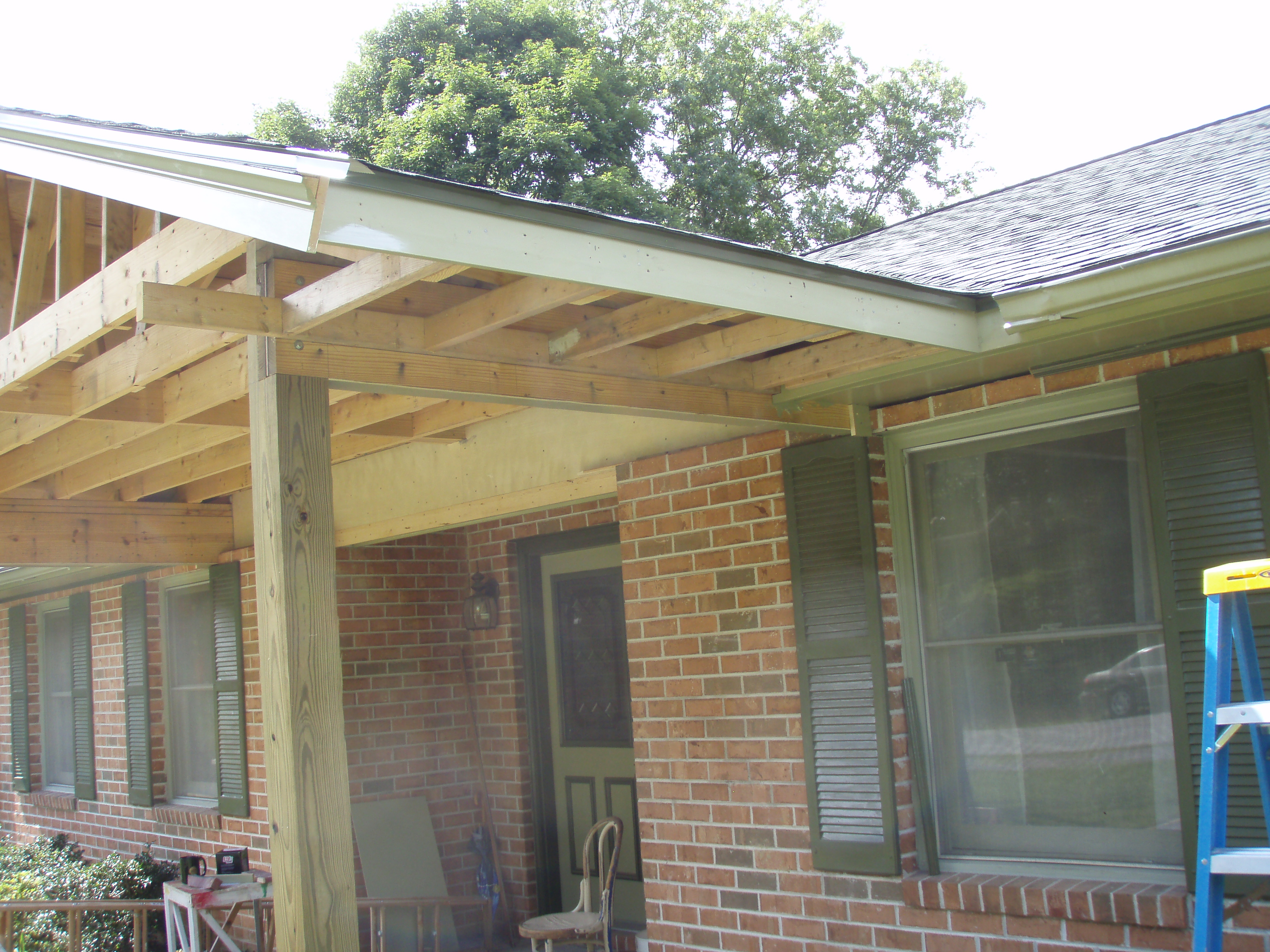 front gable porch with brick raised garden