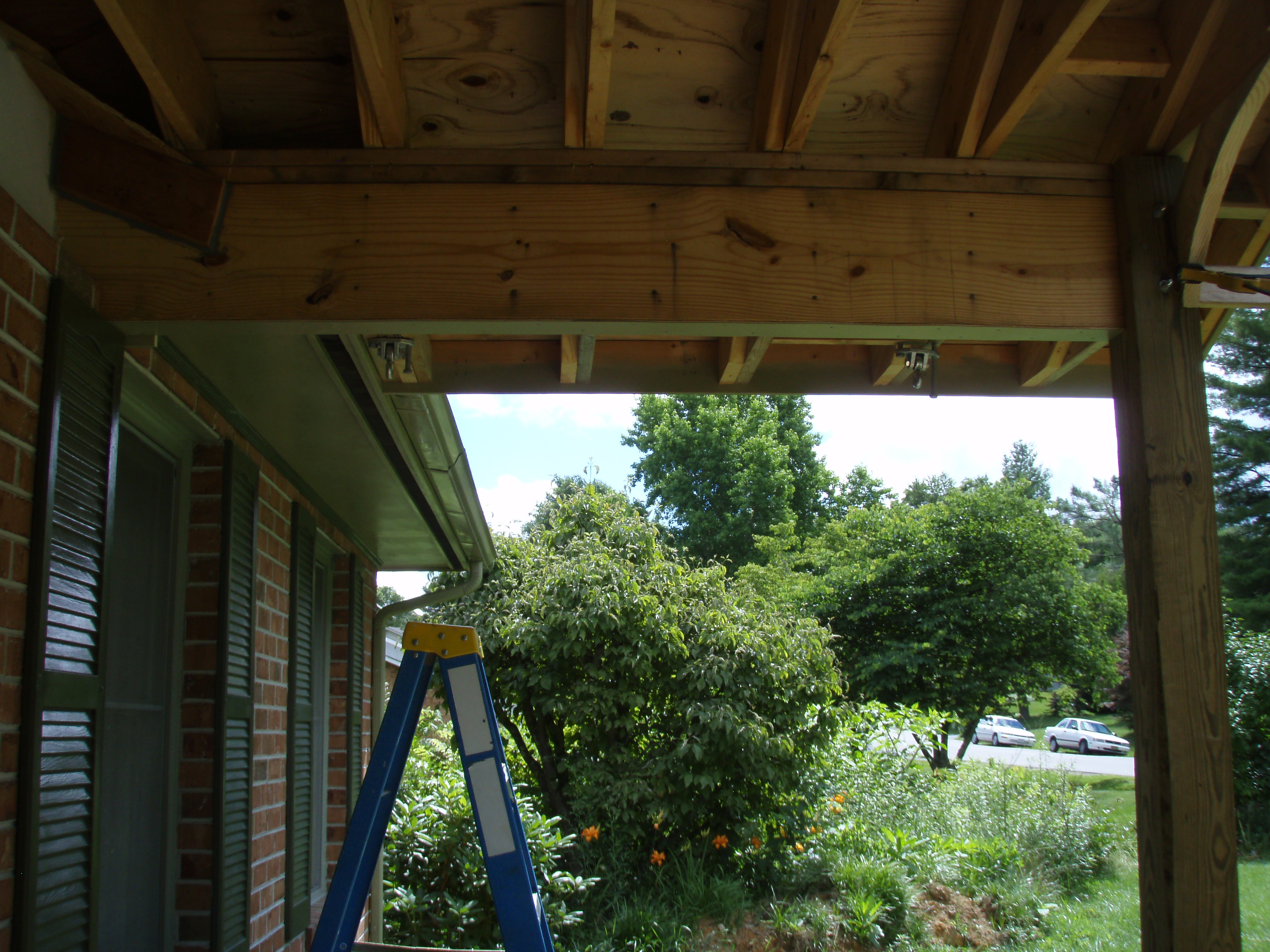 front gable porch with brick raised garden