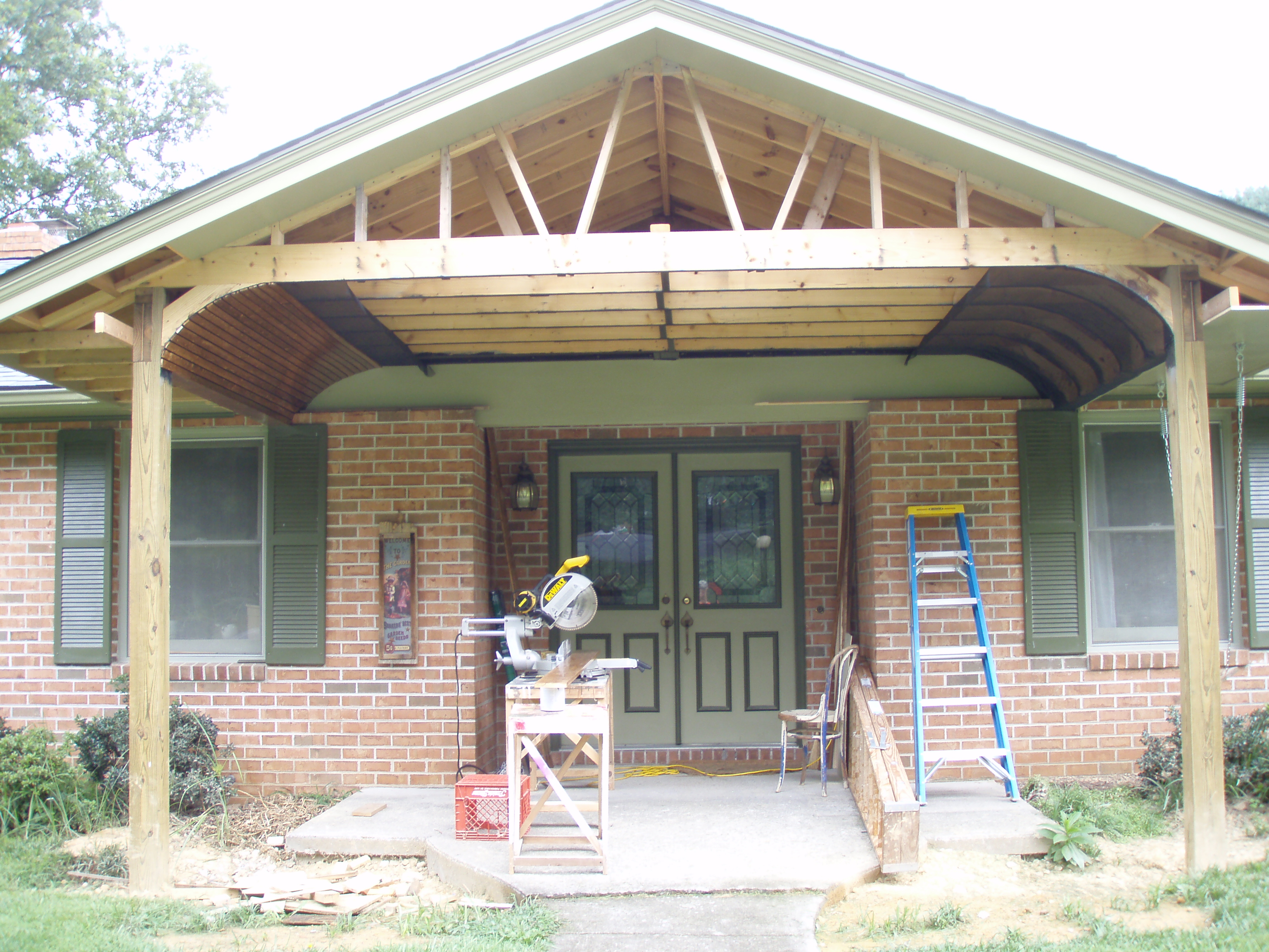 front gable porch with brick raised garden