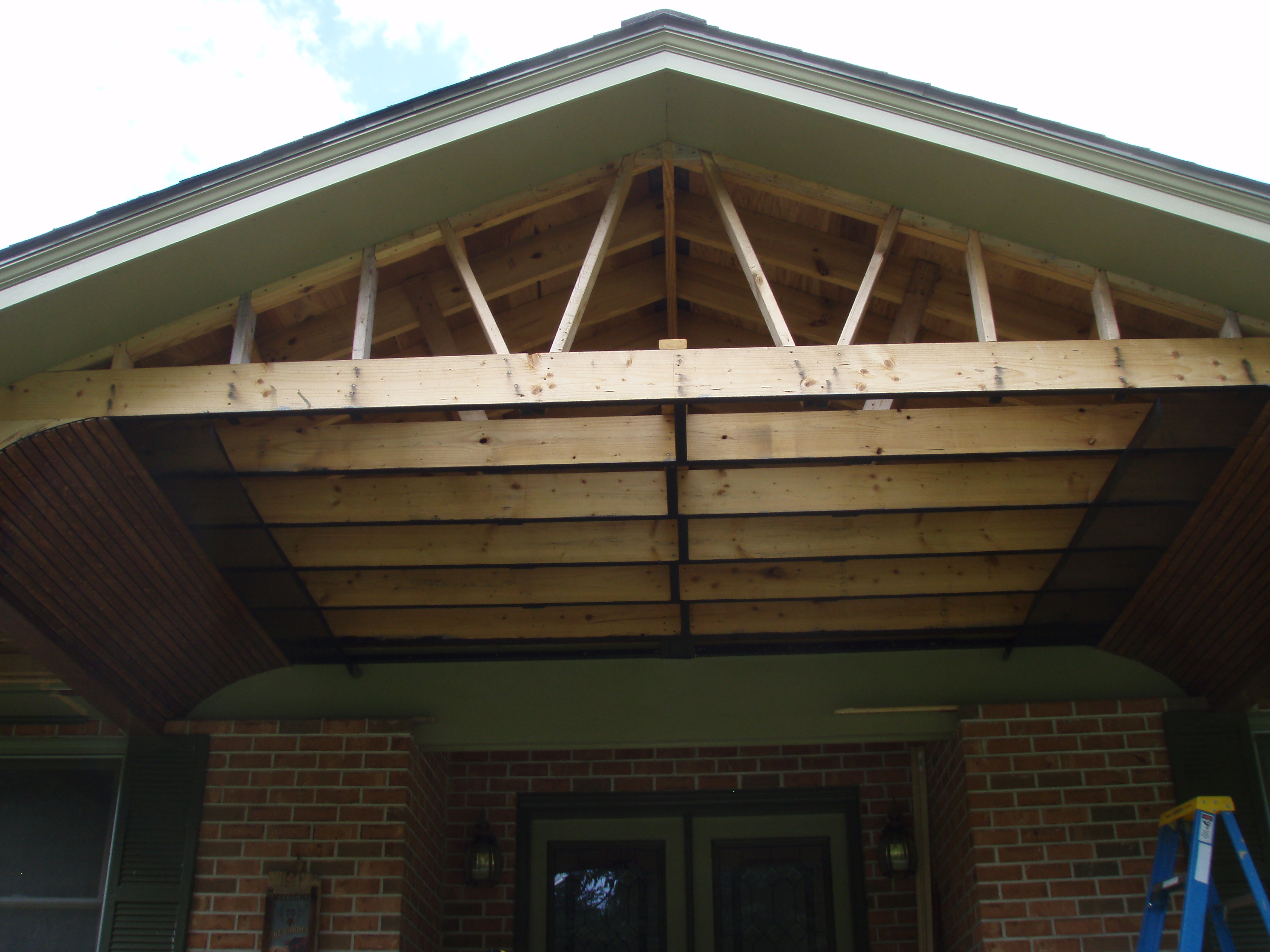 front gable porch with brick raised garden