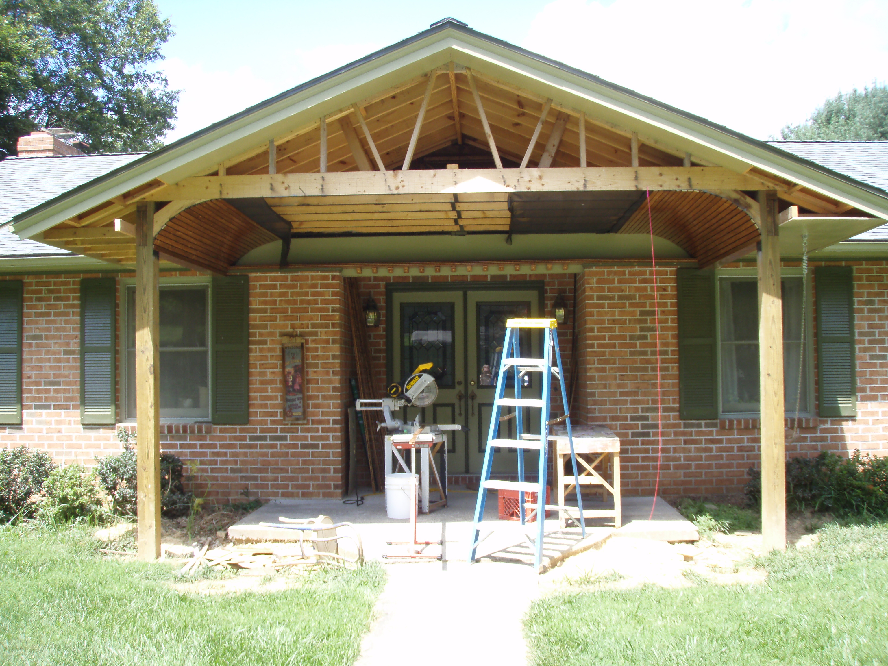 front gable porch with brick raised garden