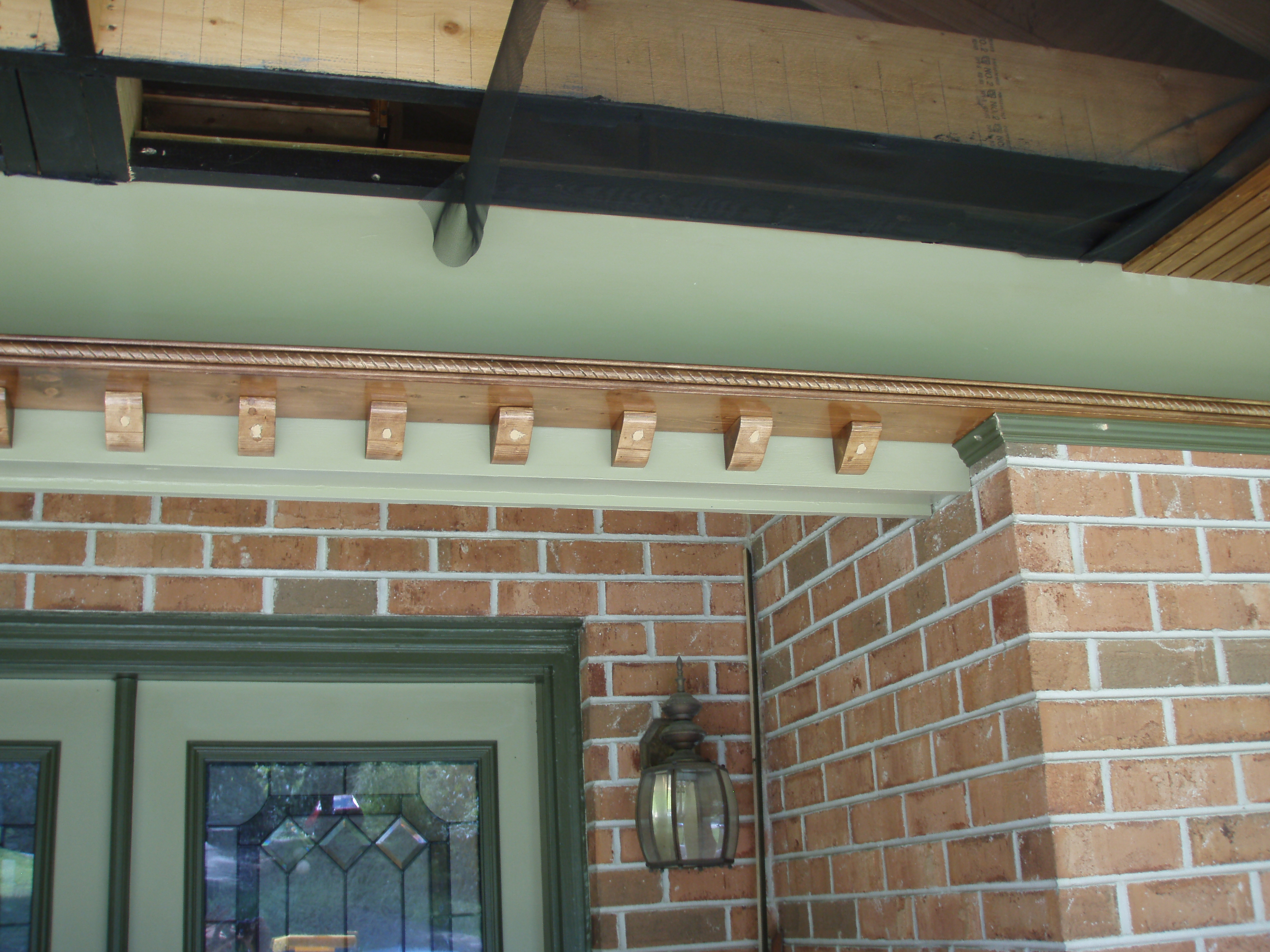 front gable porch with brick raised garden