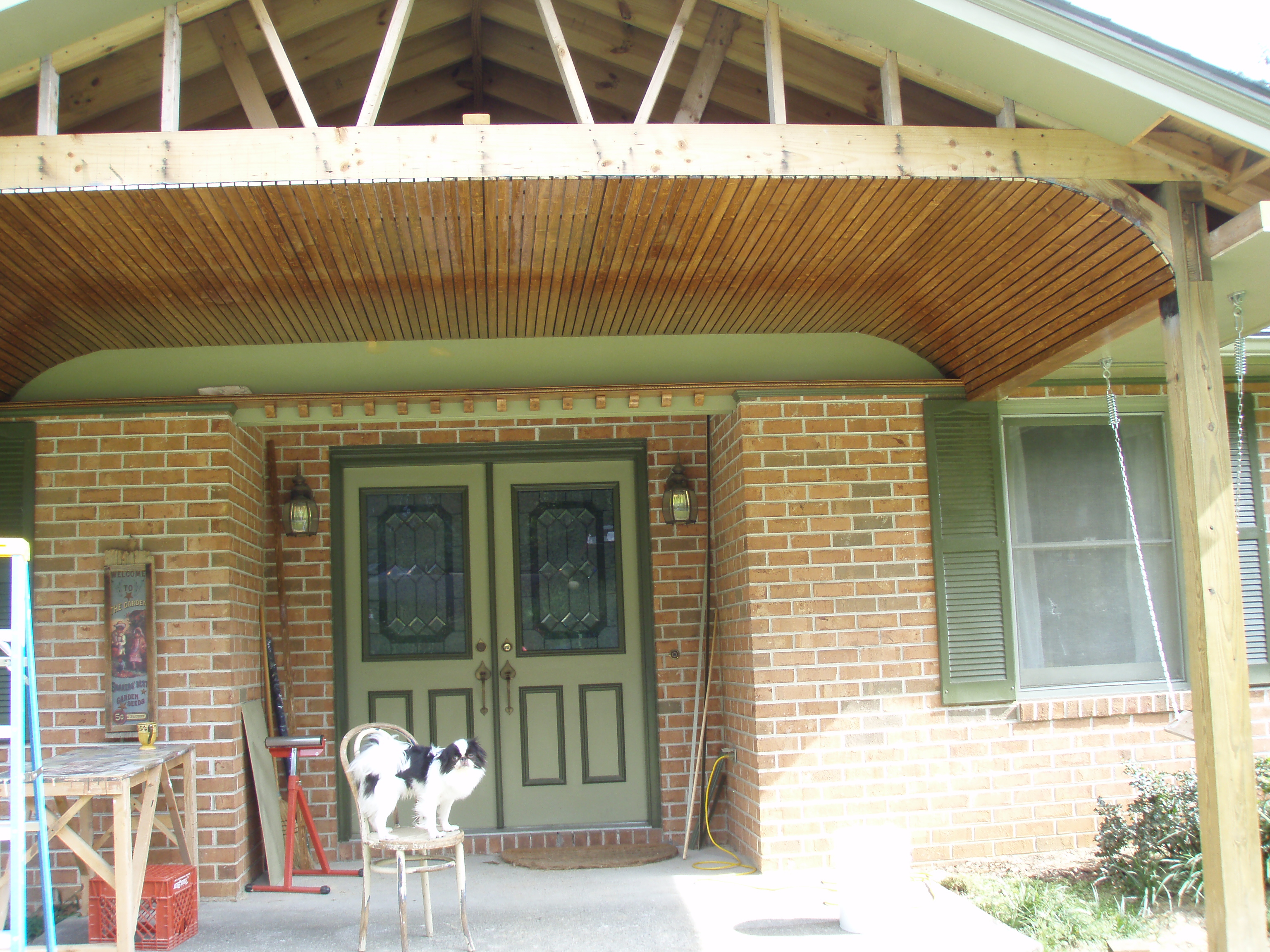 front gable porch with brick raised garden