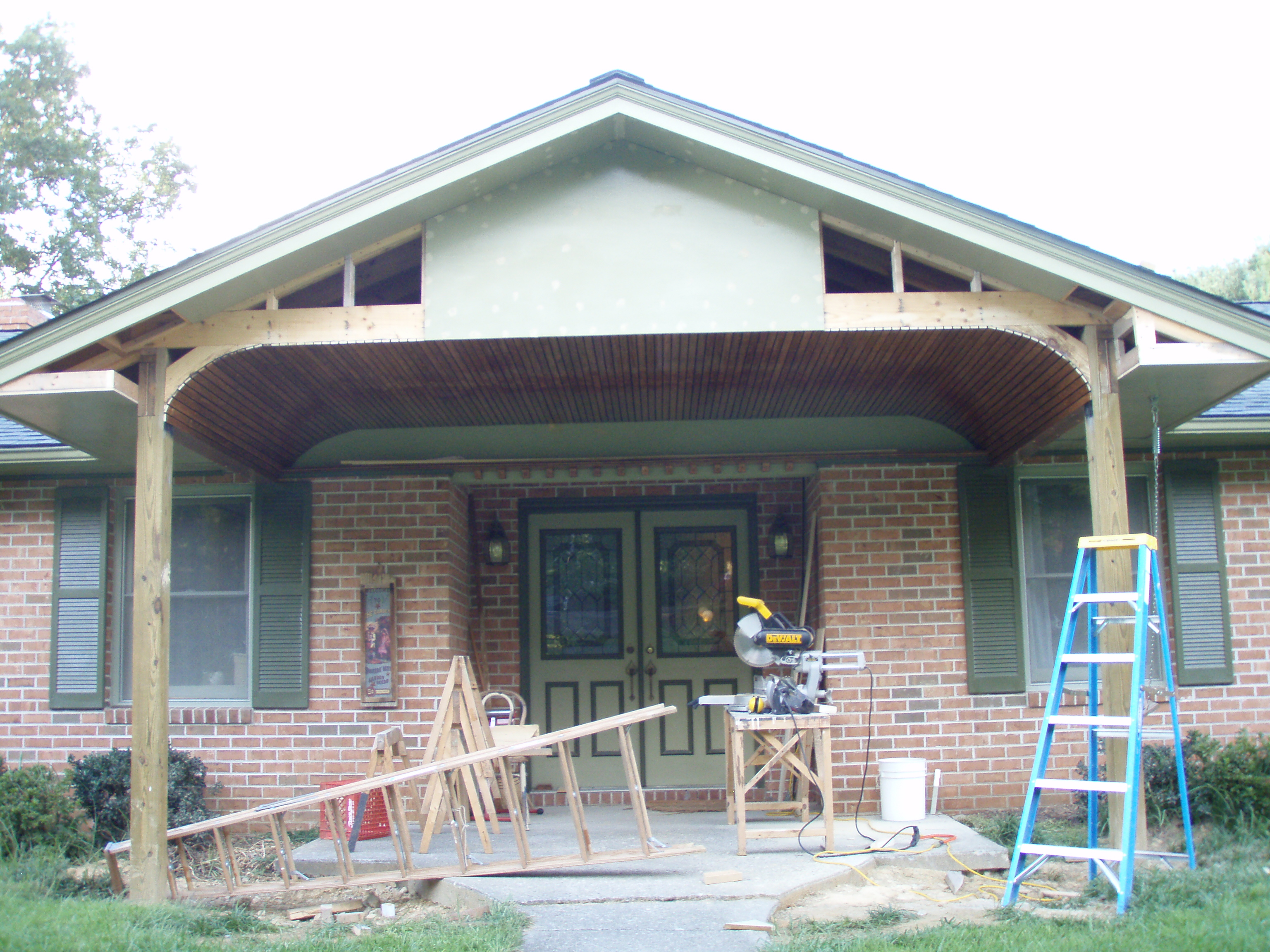 front gable porch with brick raised garden