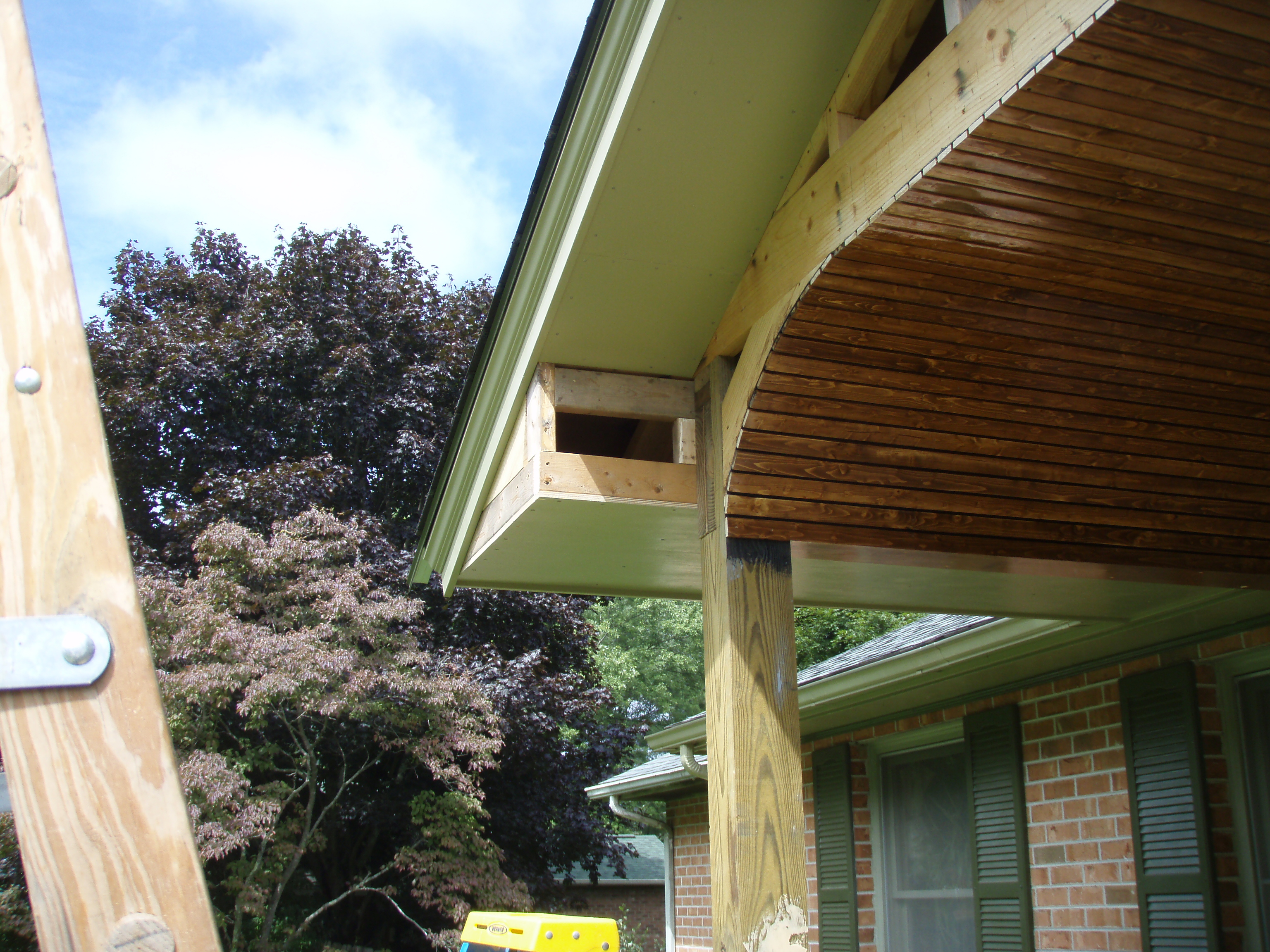 front gable porch with brick raised garden