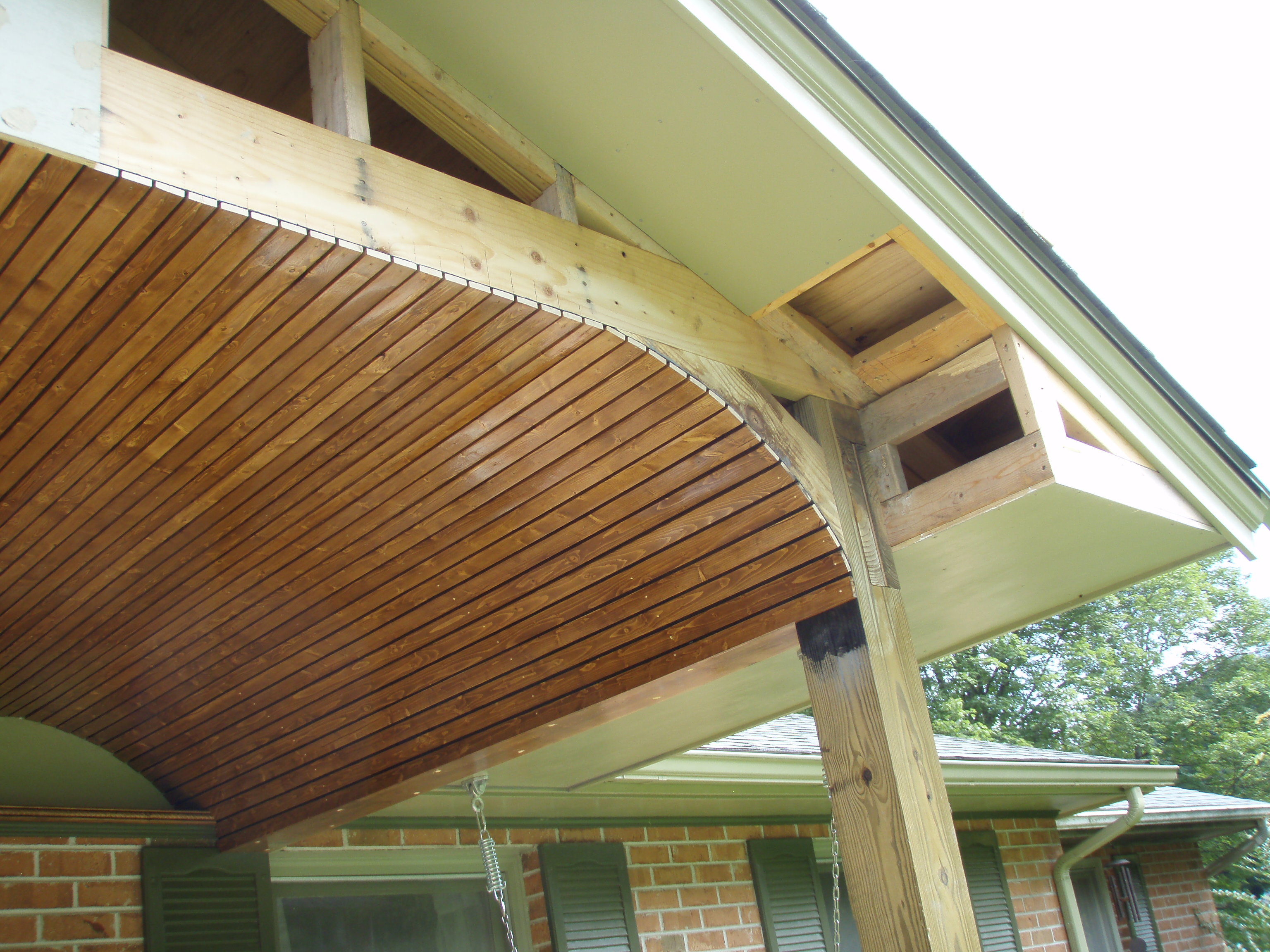 front gable porch with brick raised garden