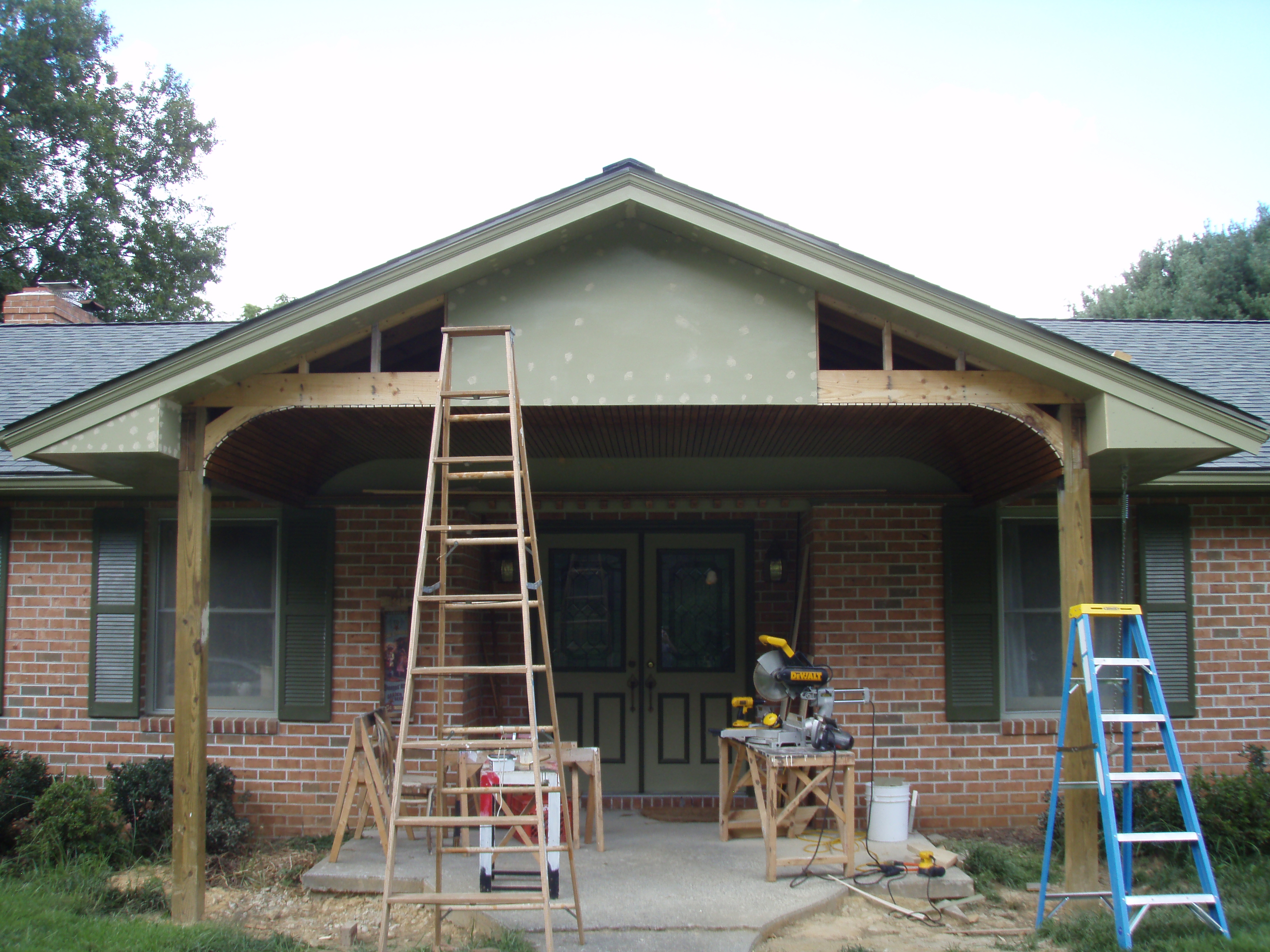 front gable porch with brick raised garden