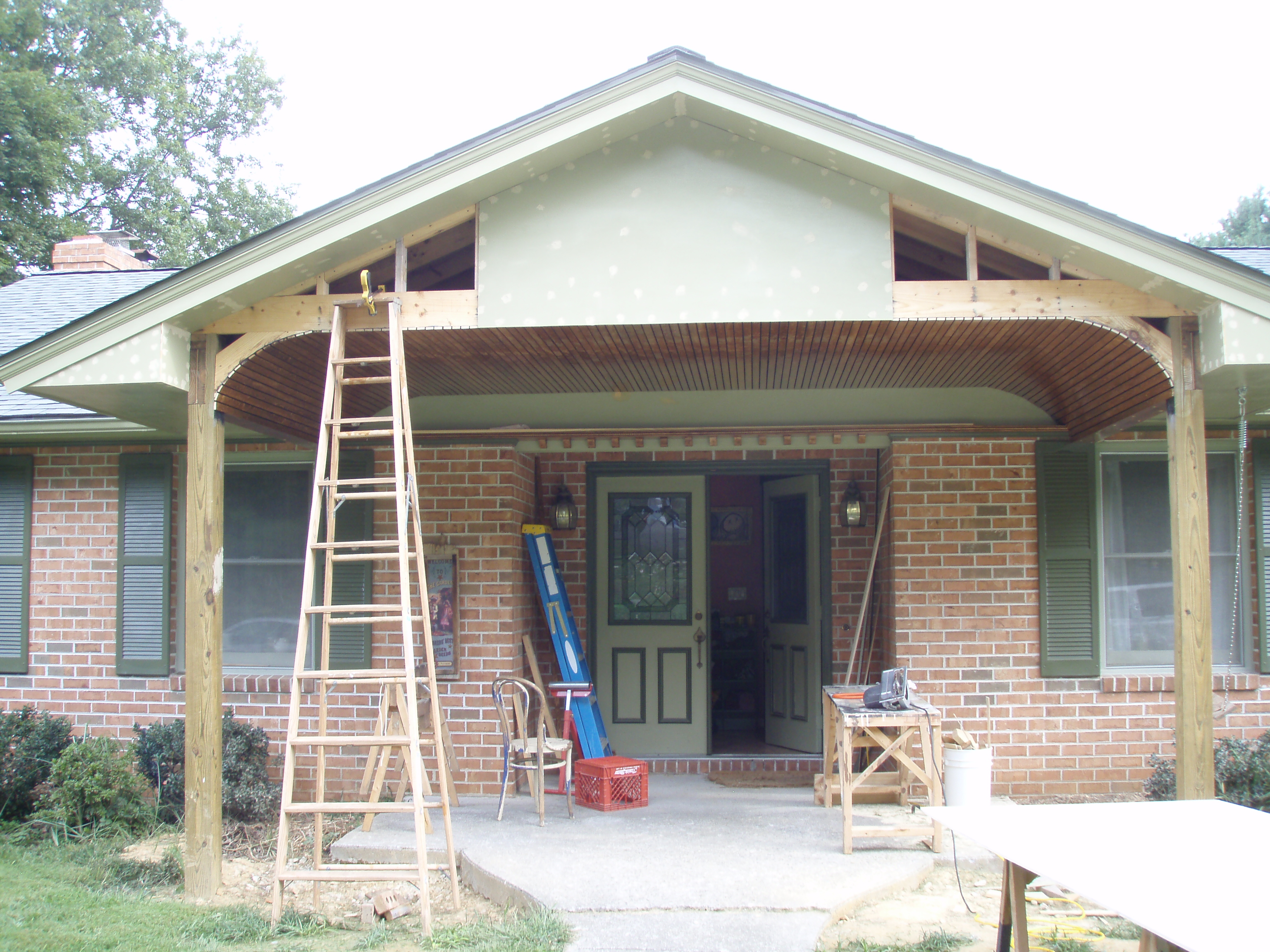 front gable porch with brick raised garden