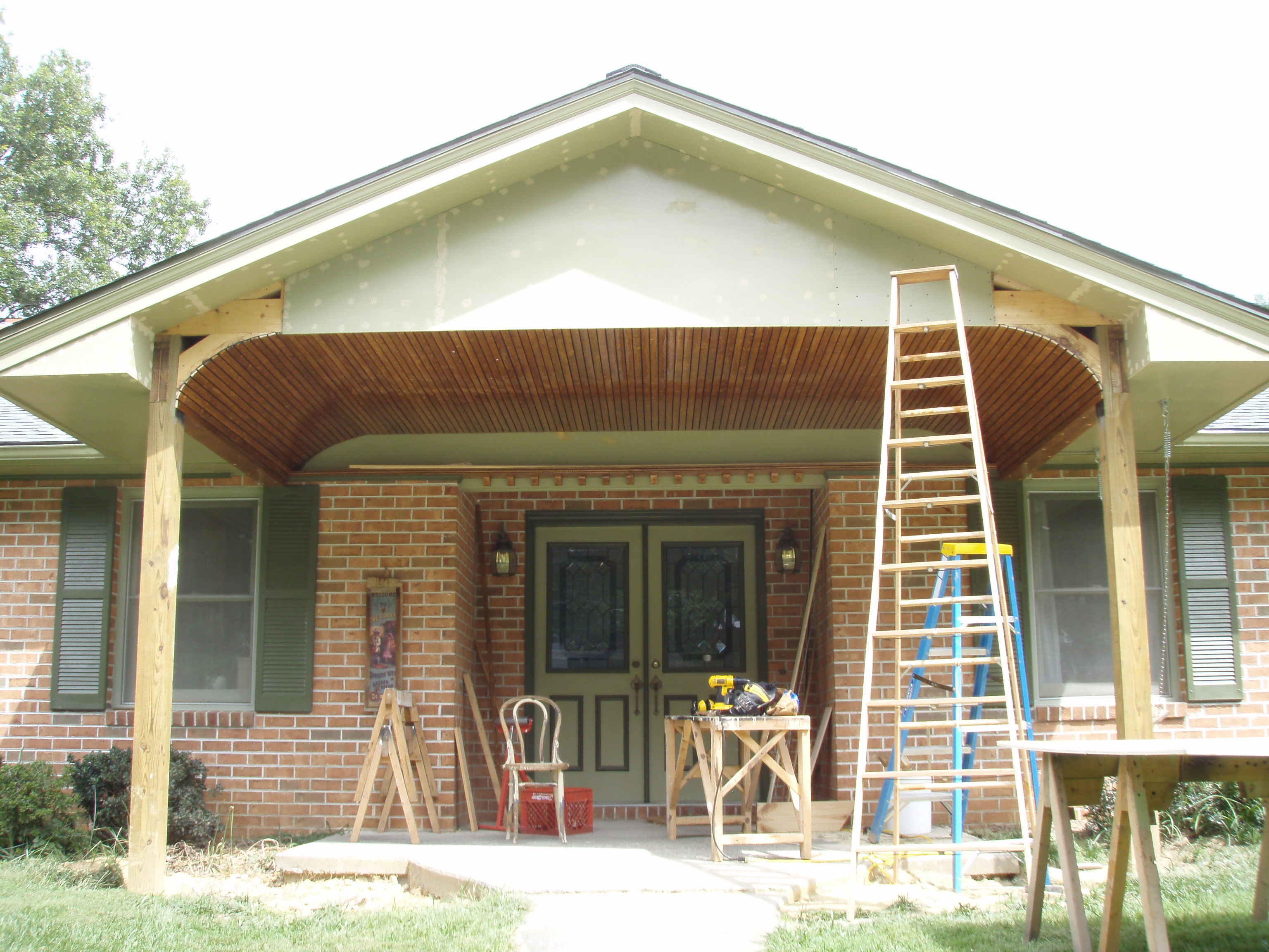 front gable porch with brick raised garden