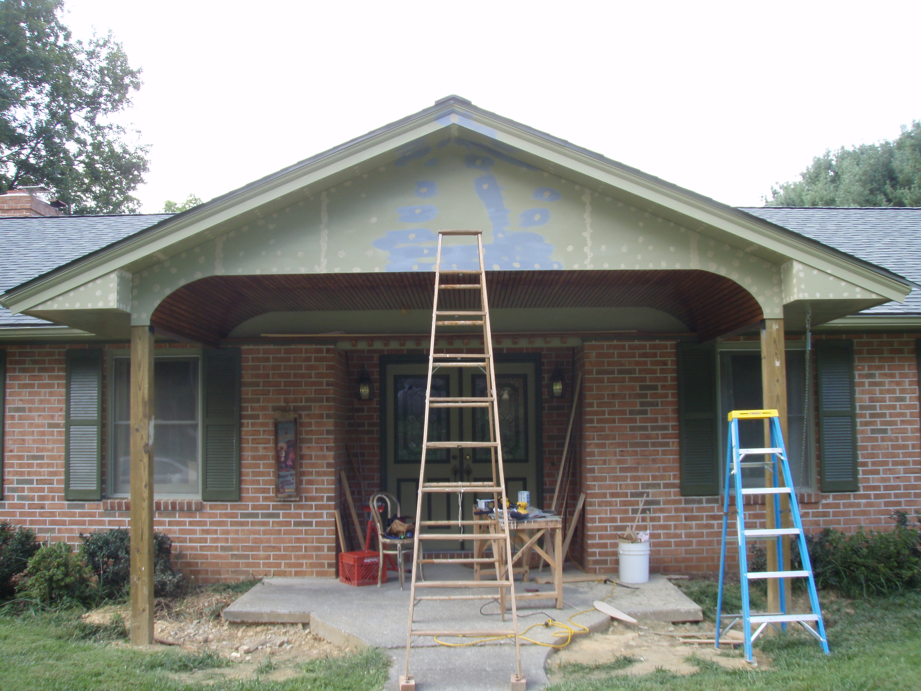 front gable porch with brick raised garden