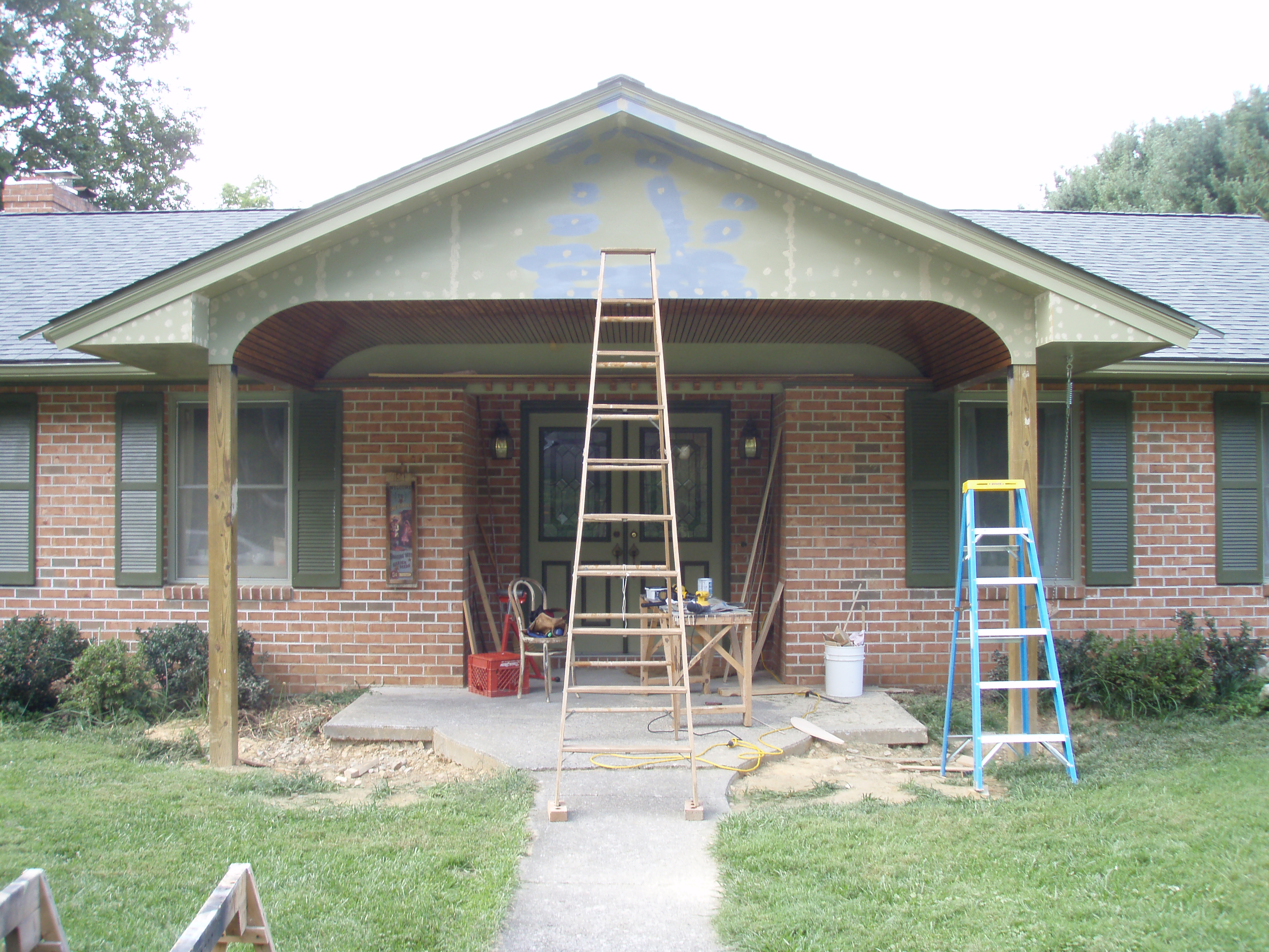 front gable porch with brick raised garden