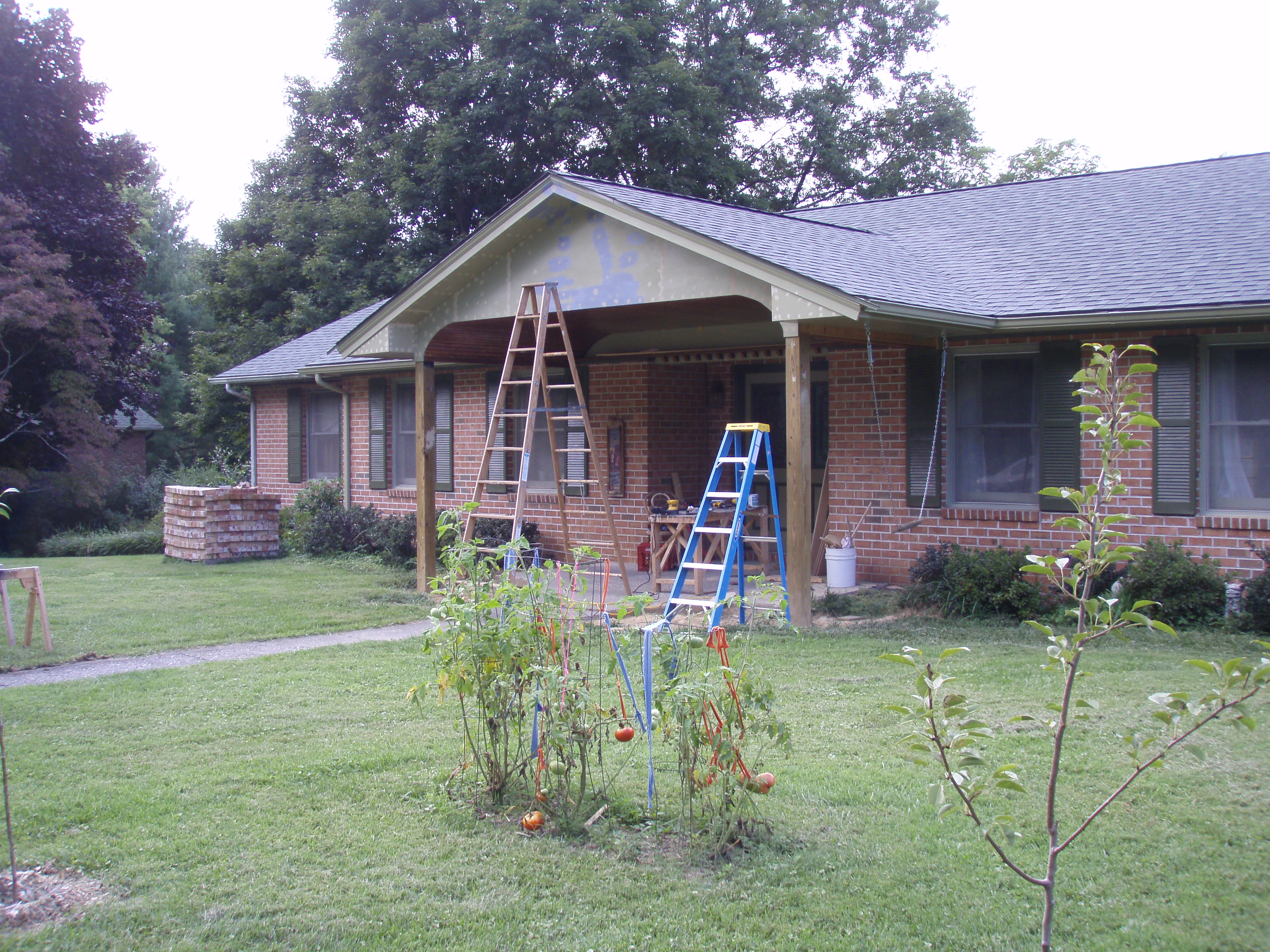 front gable porch with brick raised garden