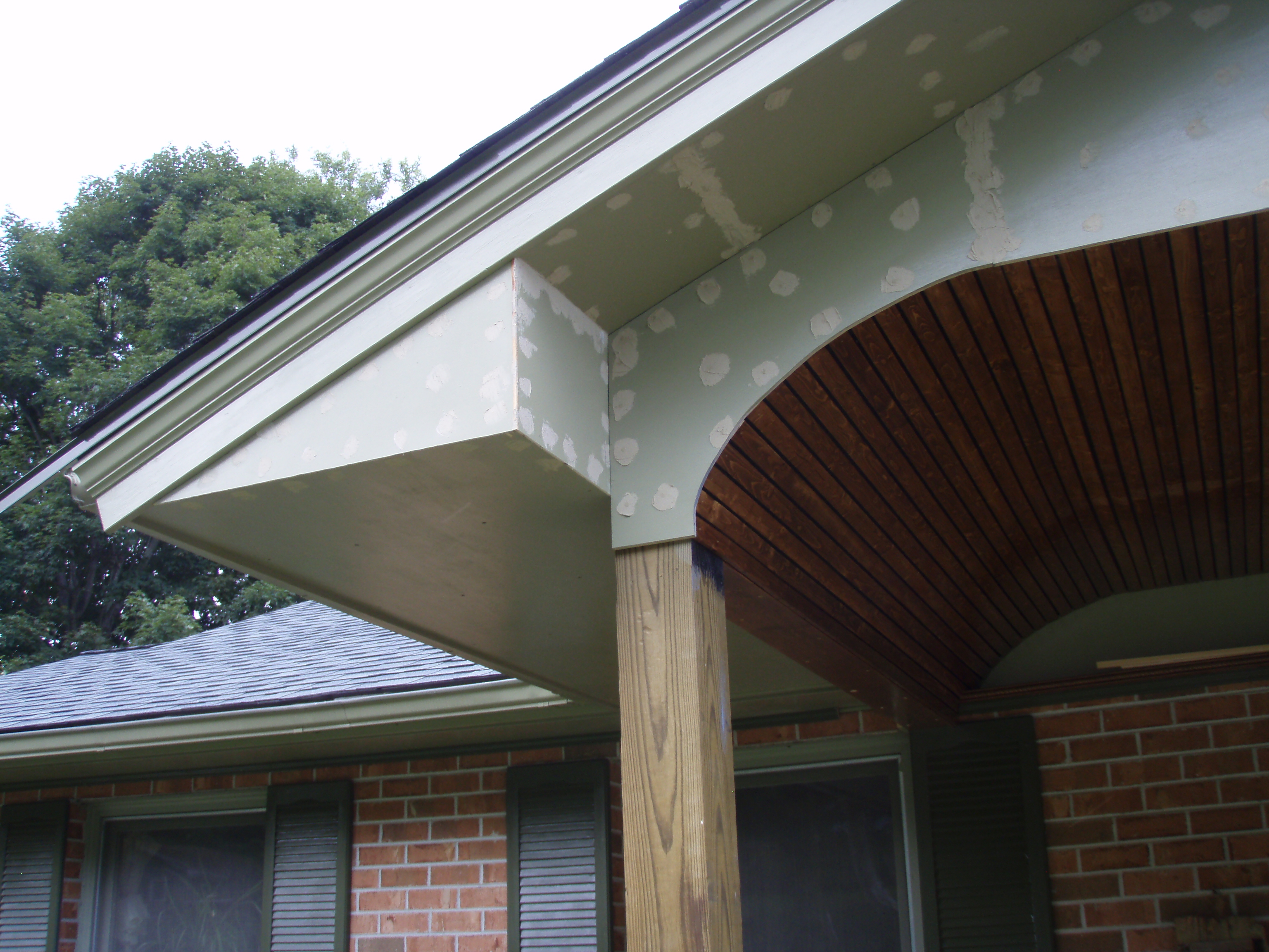 front gable porch with brick raised garden