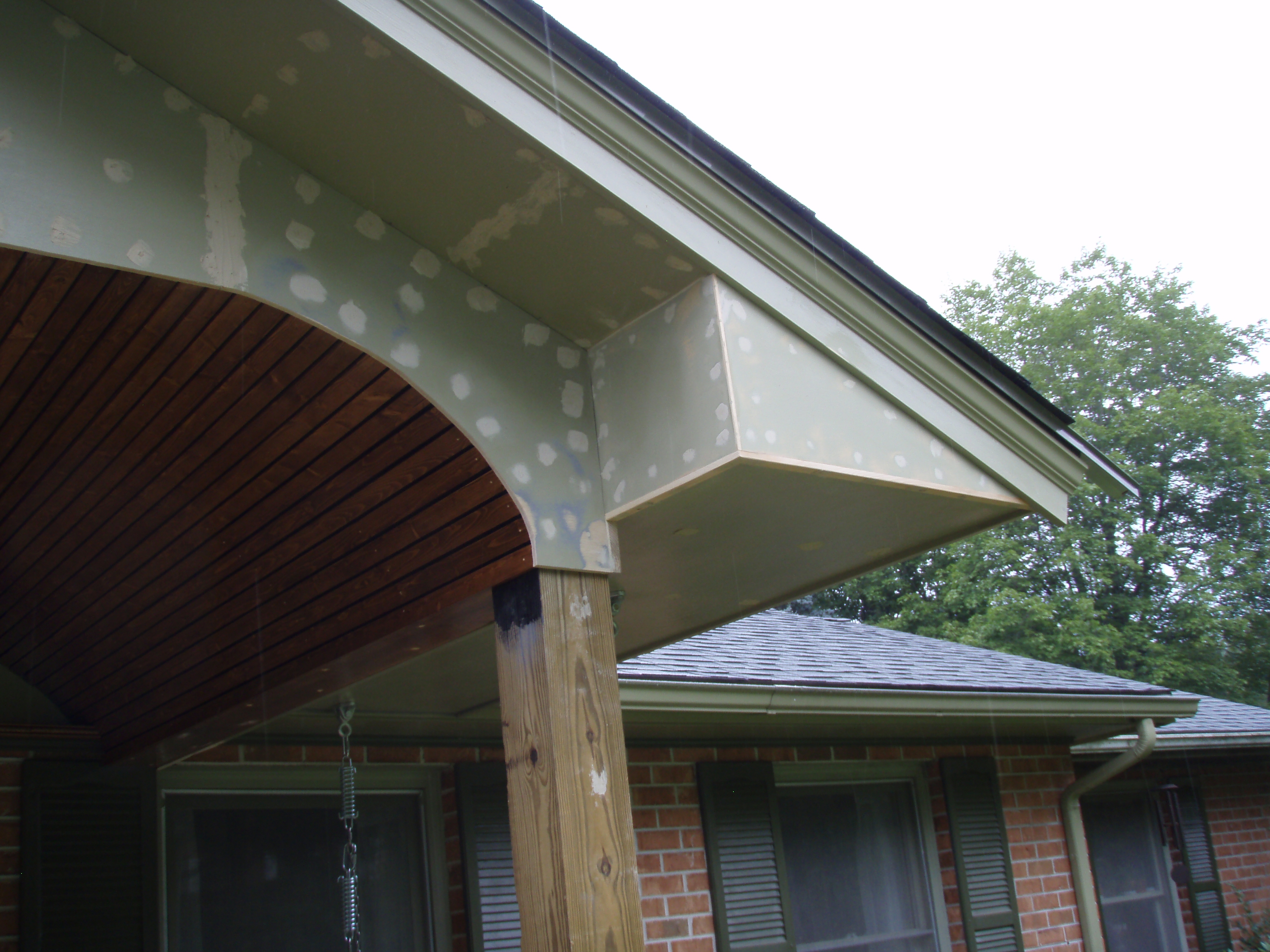 front gable porch with brick raised garden