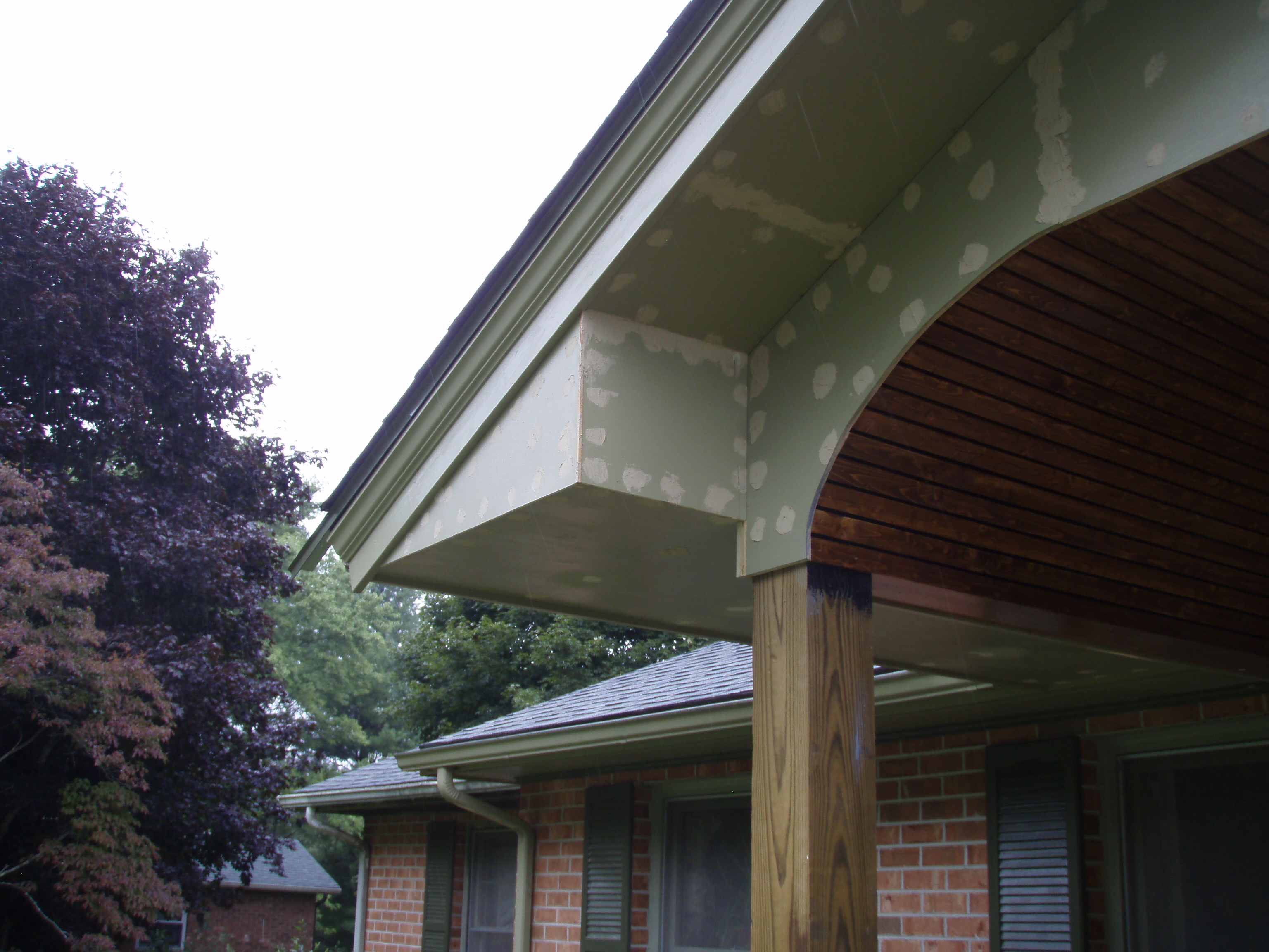 front gable porch with brick raised garden