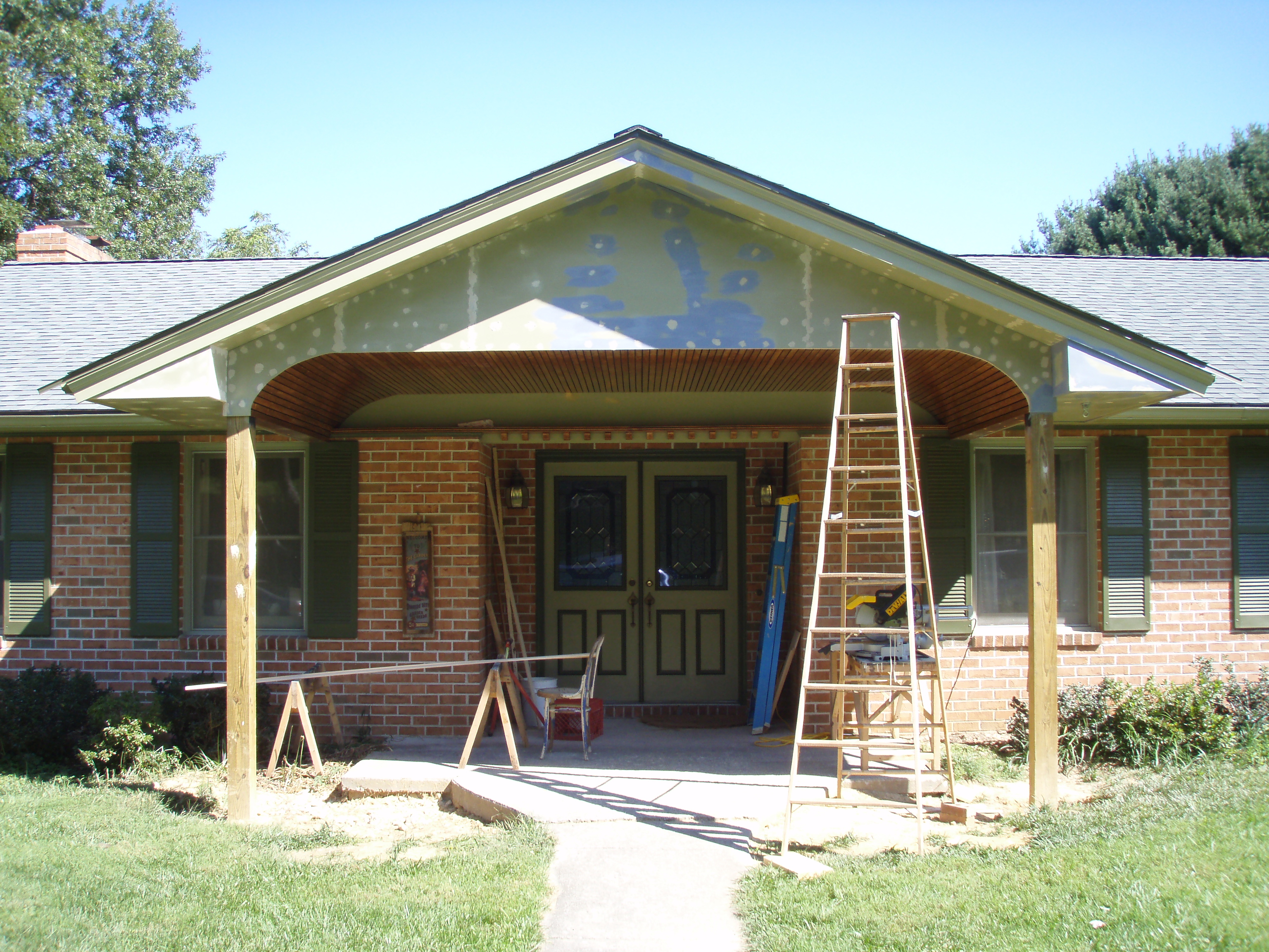 front gable porch with brick raised garden