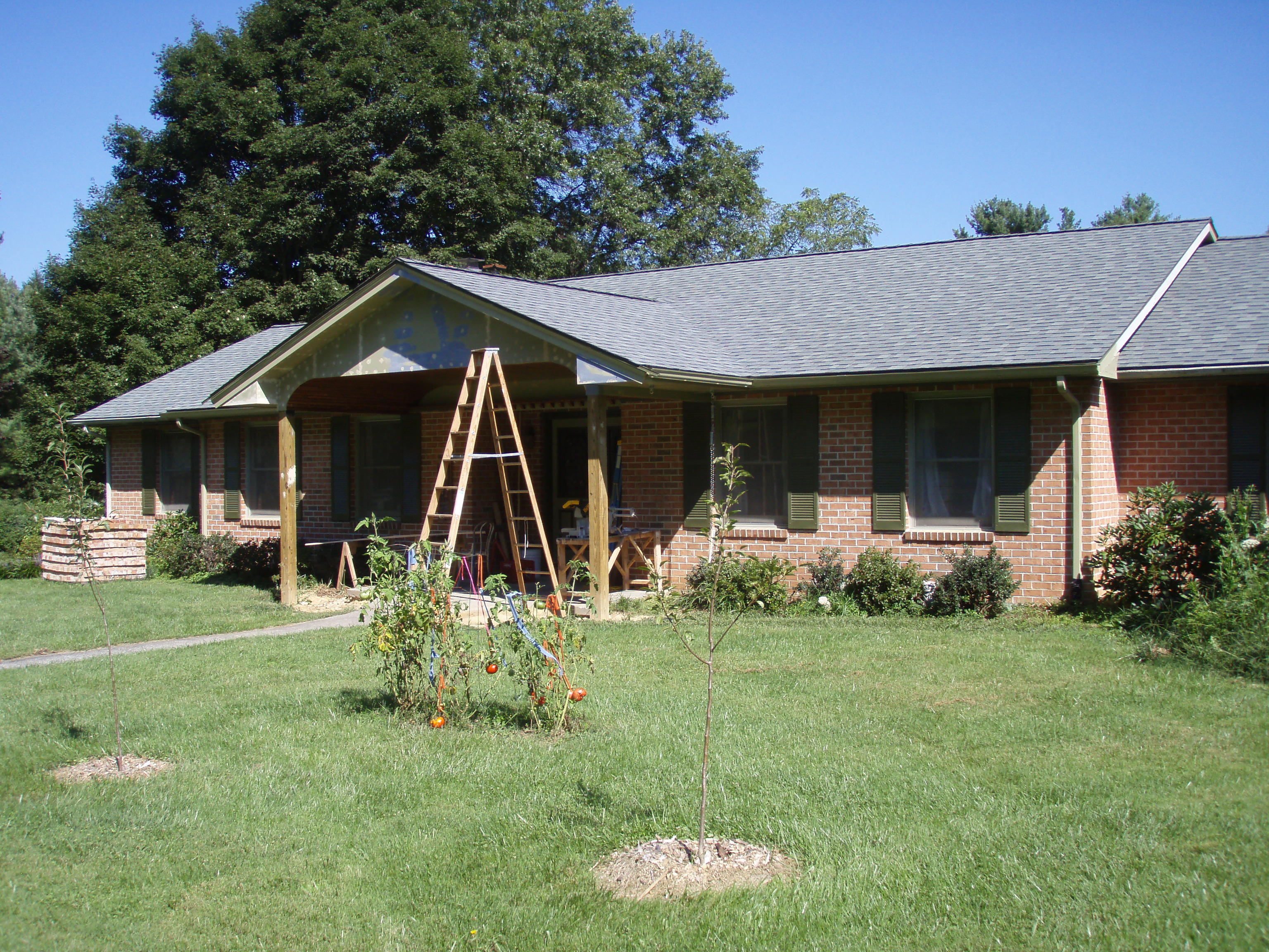 front gable porch with brick raised garden