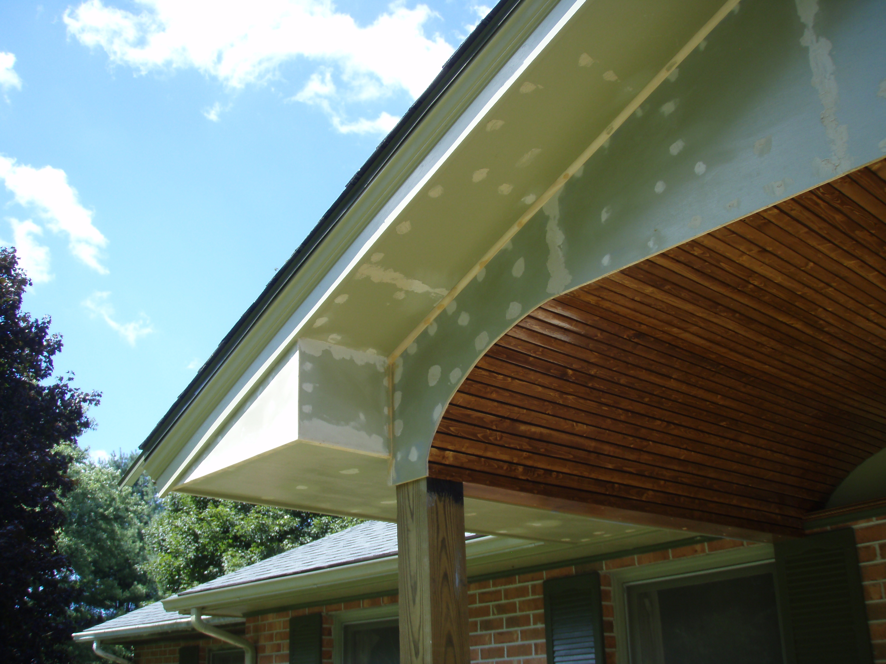 front gable porch with brick raised garden