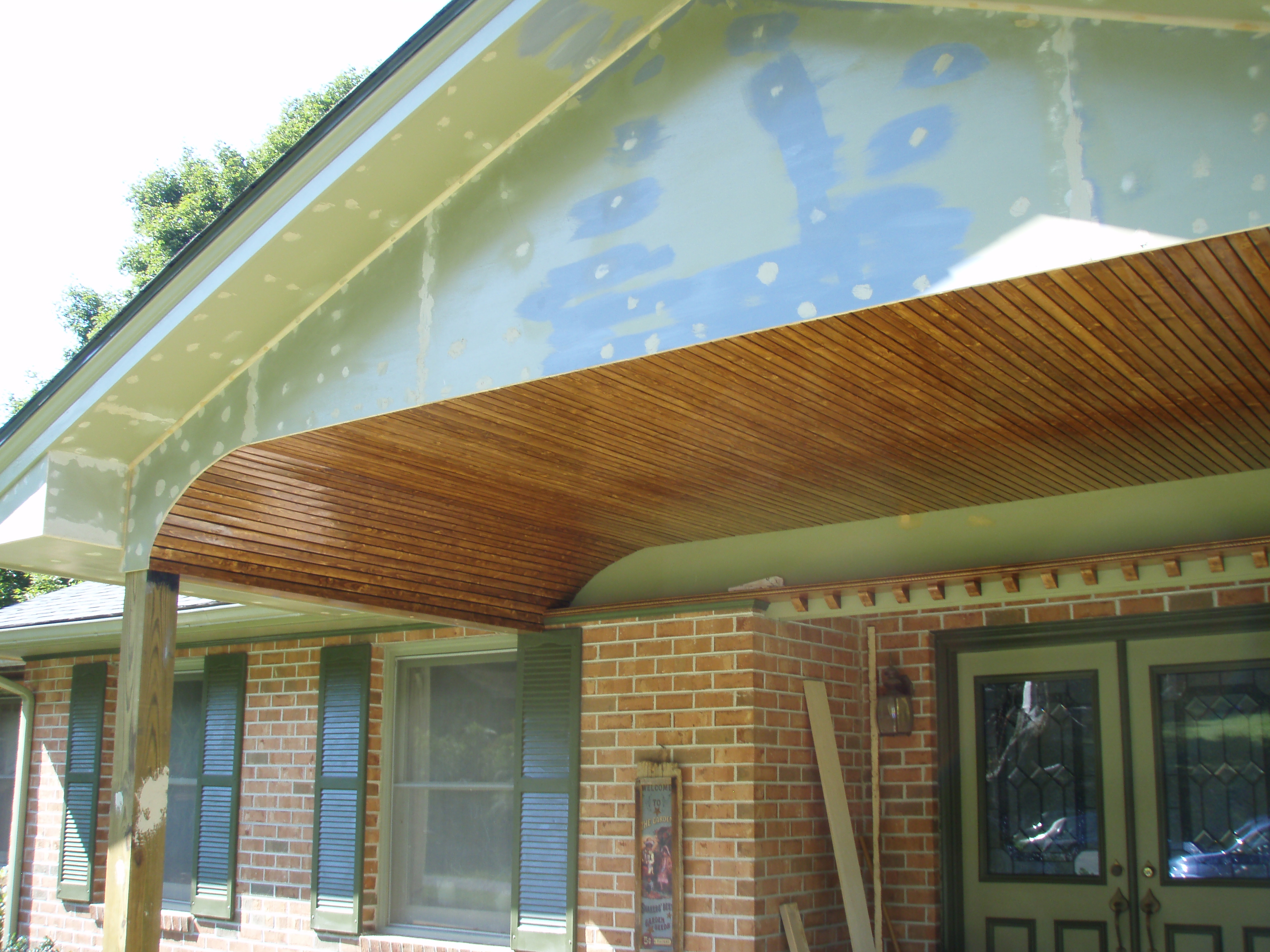 front gable porch with brick raised garden