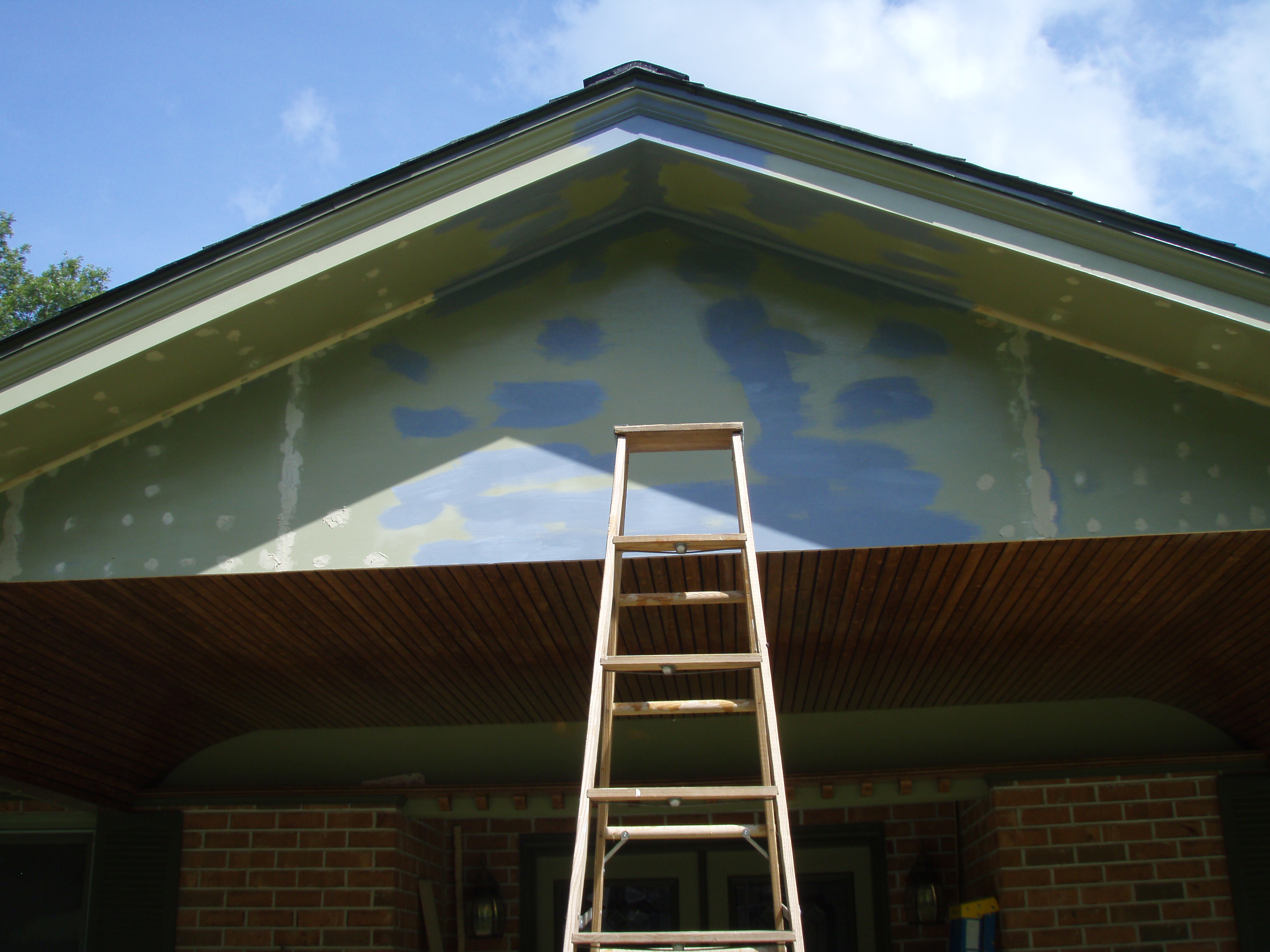 front gable porch with brick raised garden