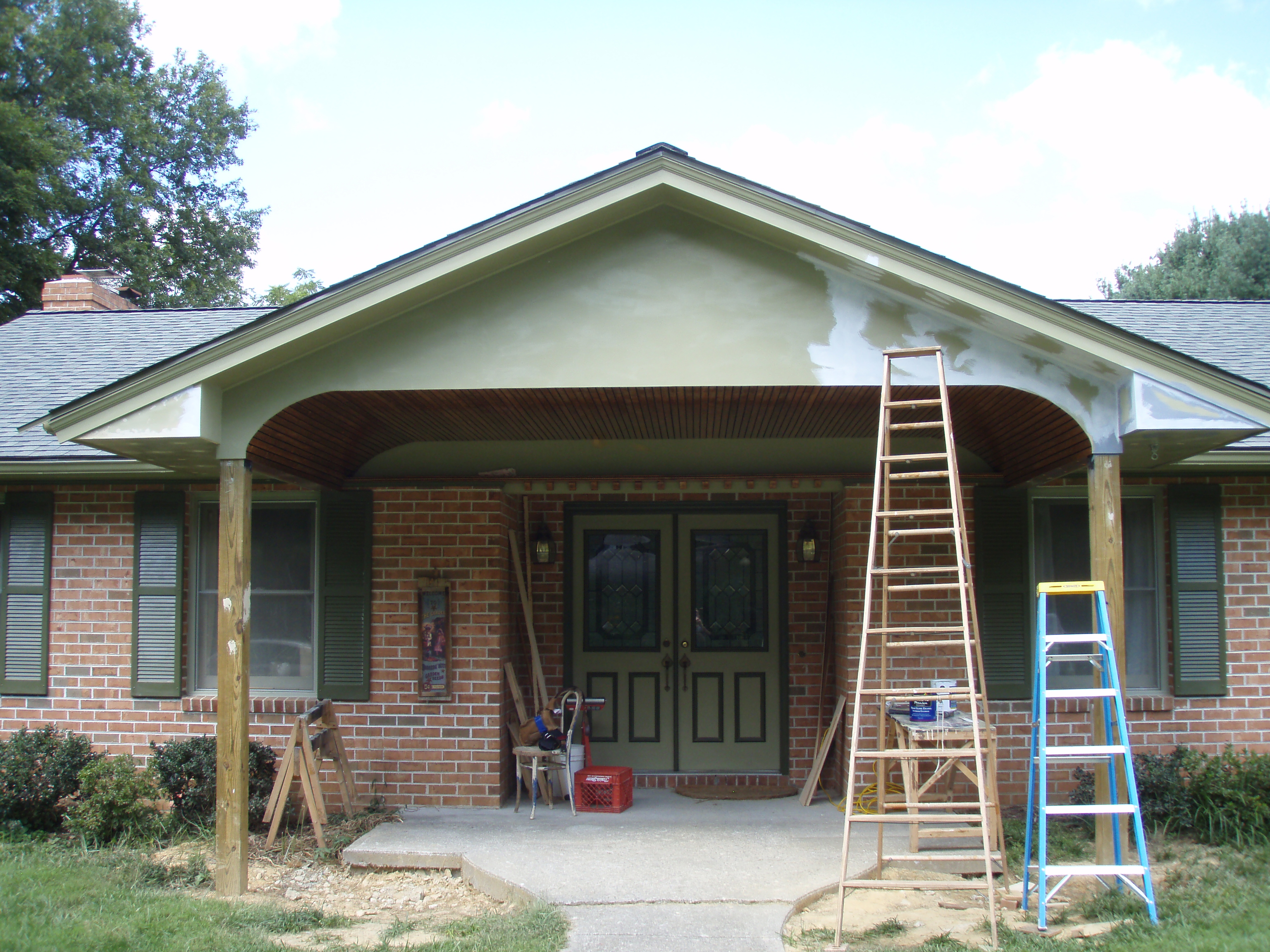 front gable porch with brick raised garden