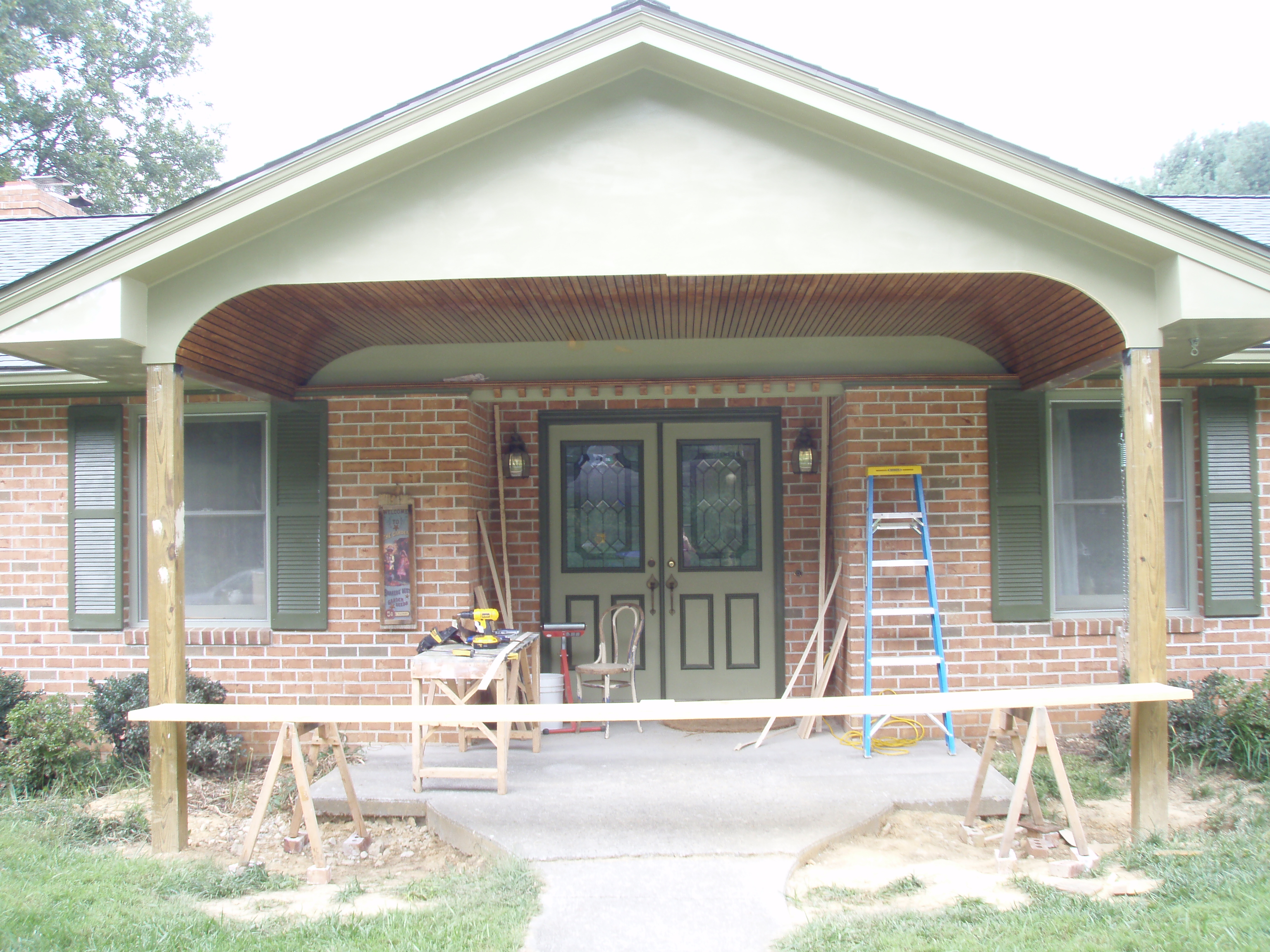 front gable porch with brick raised garden