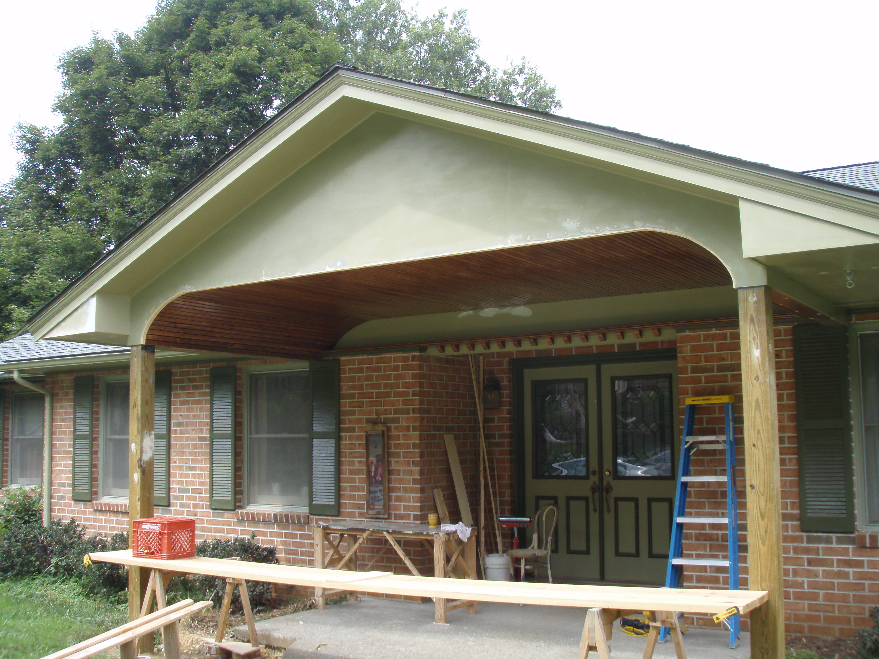 front gable porch with brick raised garden