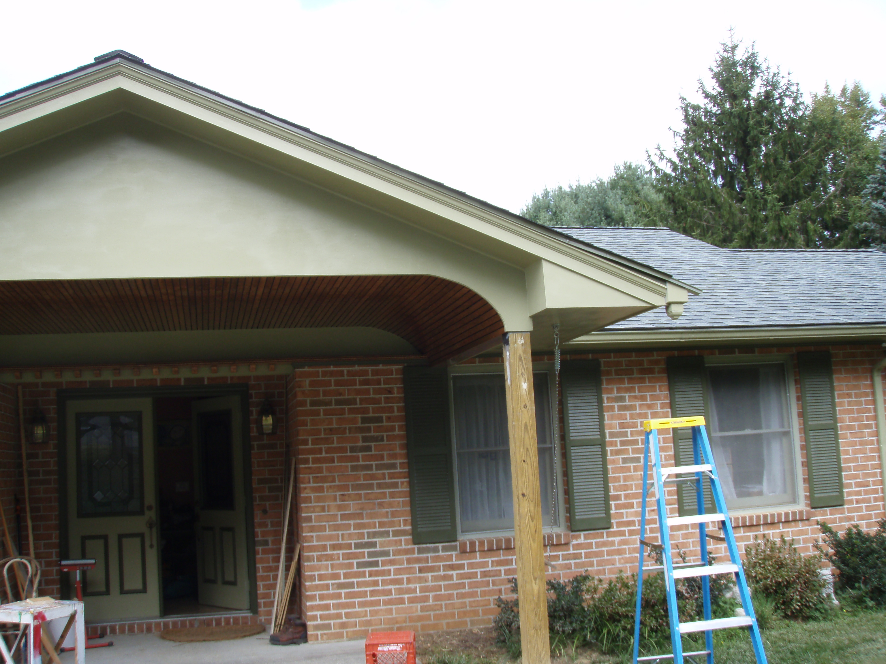 front gable porch with brick raised garden