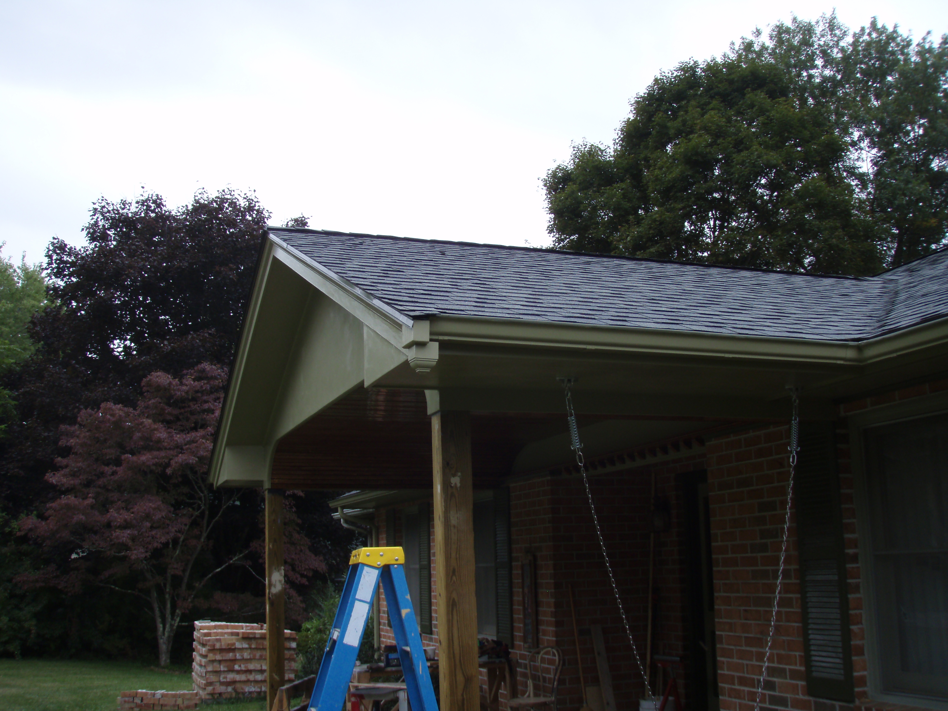 front gable porch with brick raised garden