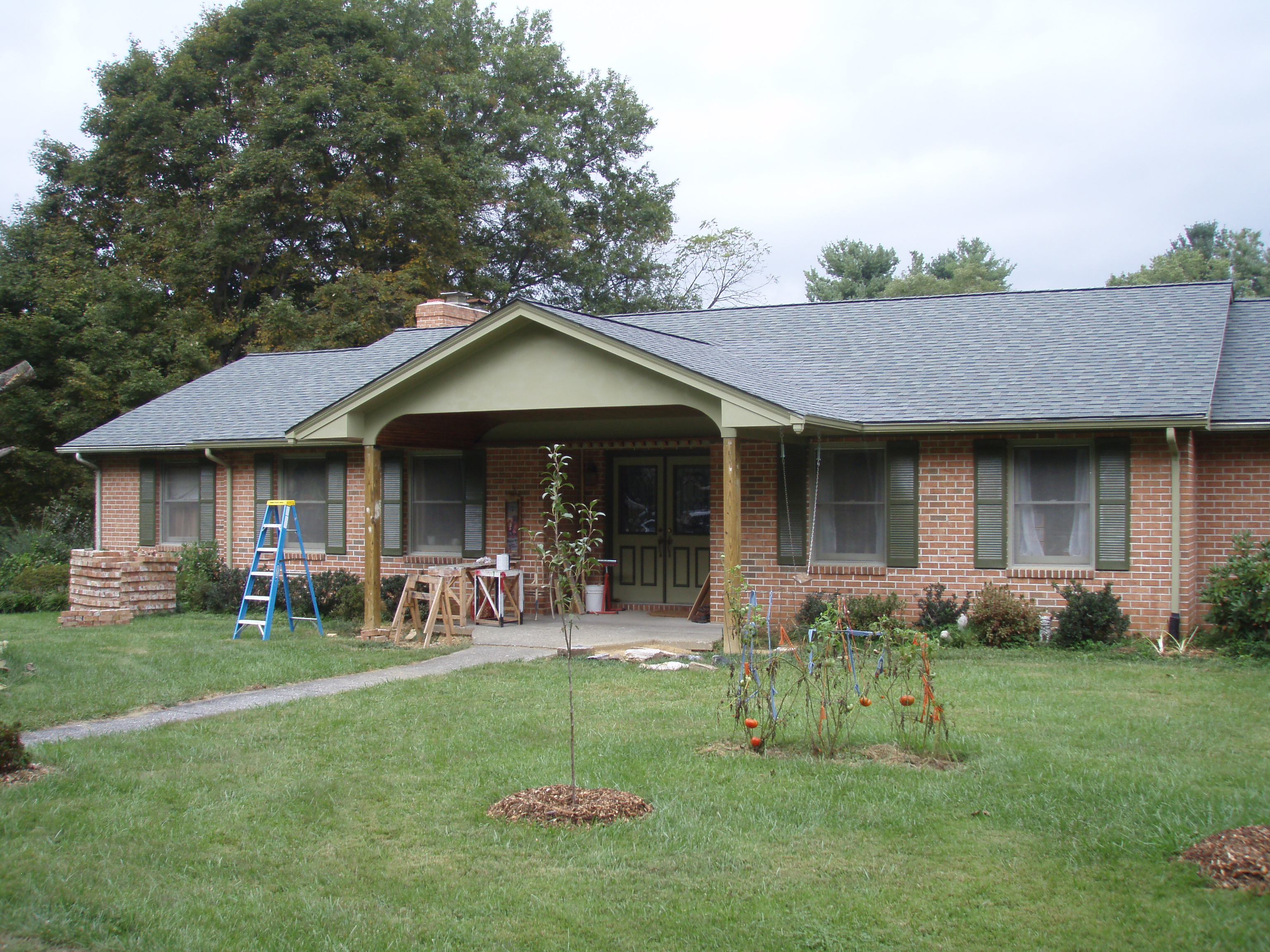 front gable porch with brick raised garden