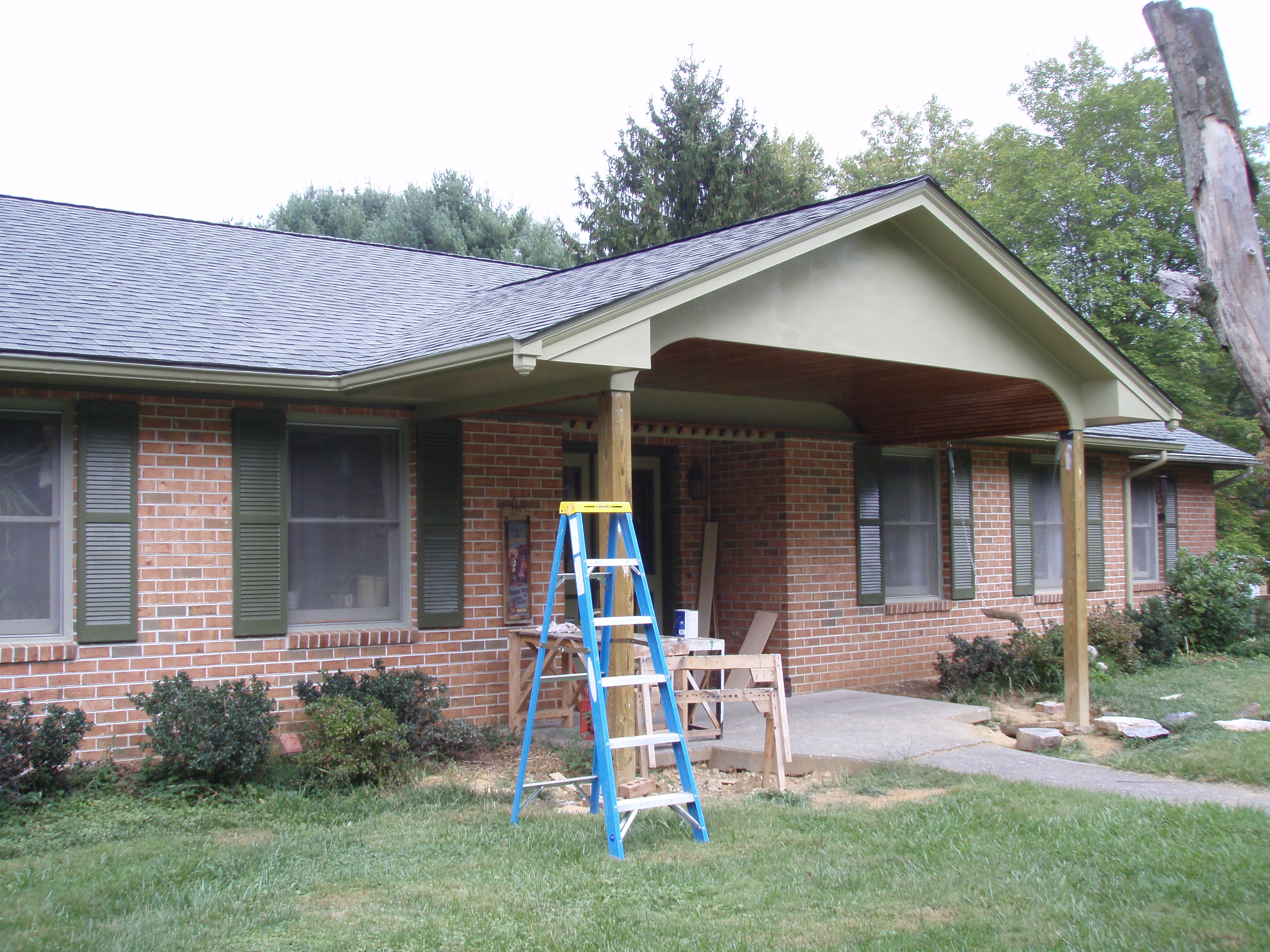 front gable porch with brick raised garden