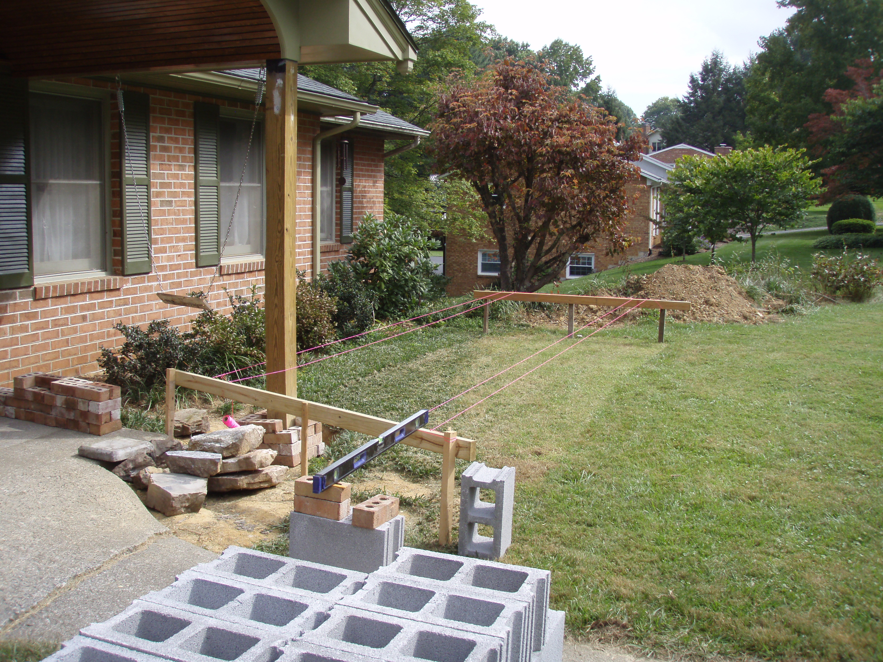 front gable porch with brick raised garden