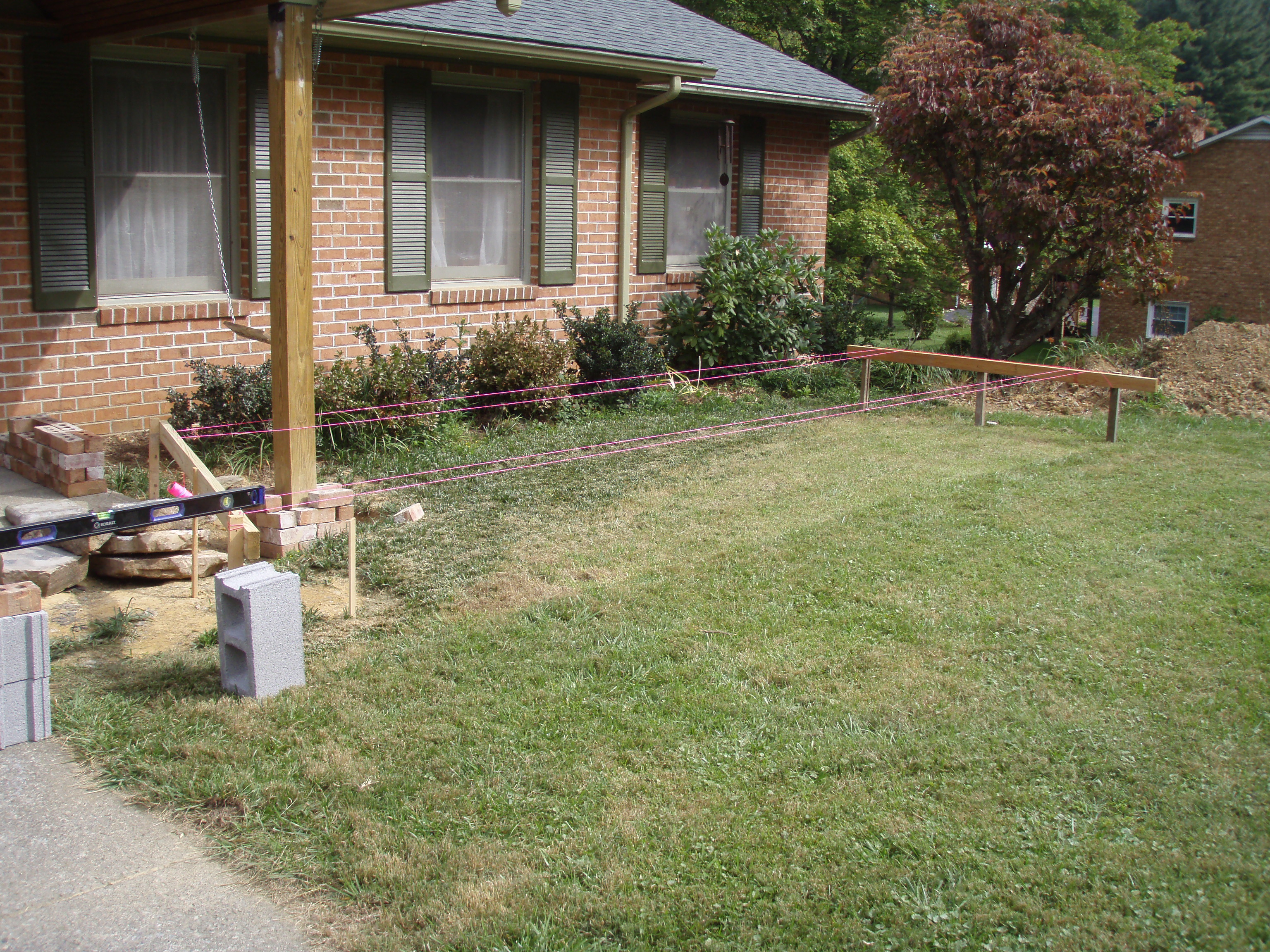 front gable porch with brick raised garden