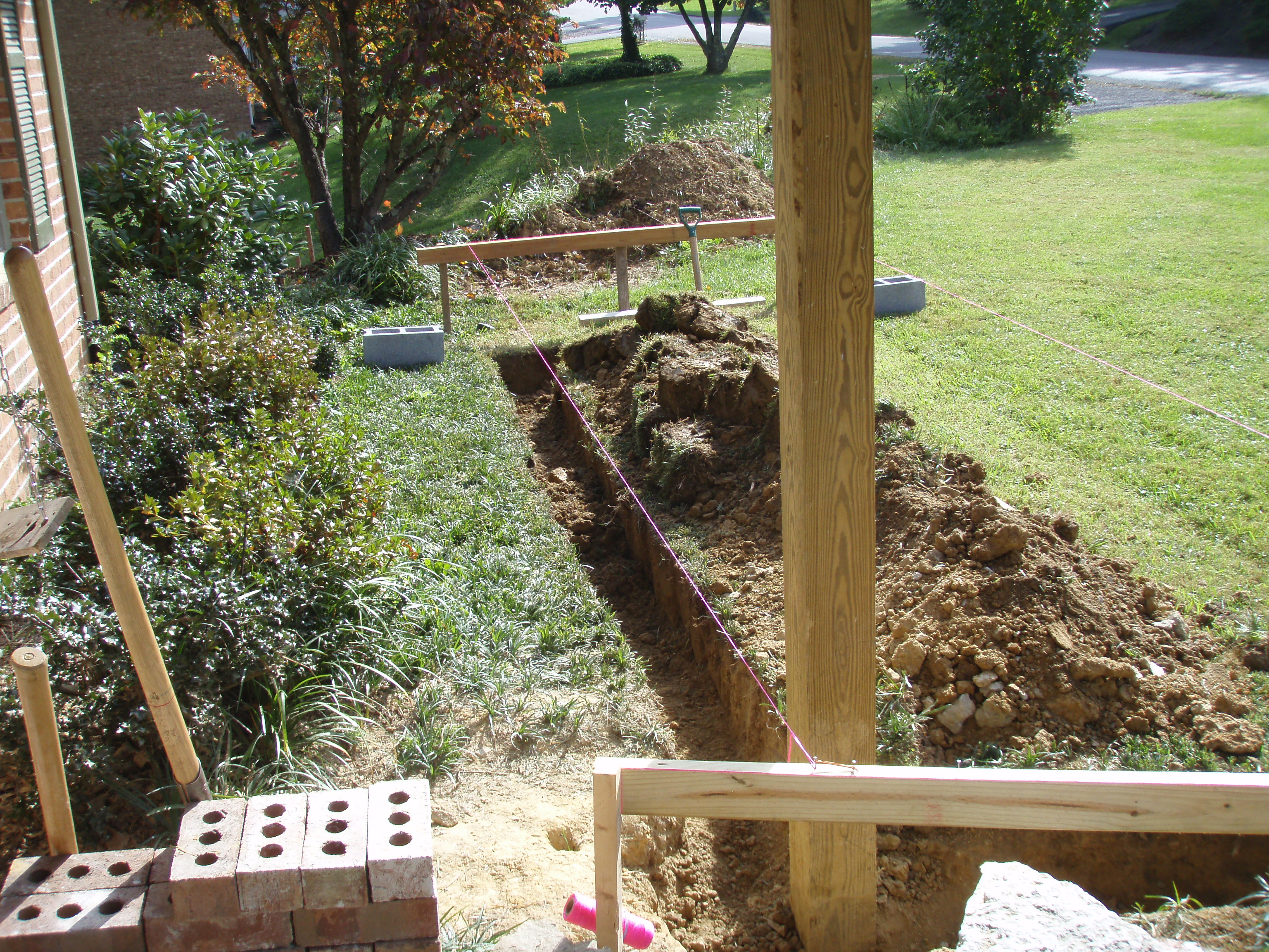 front gable porch with brick raised garden