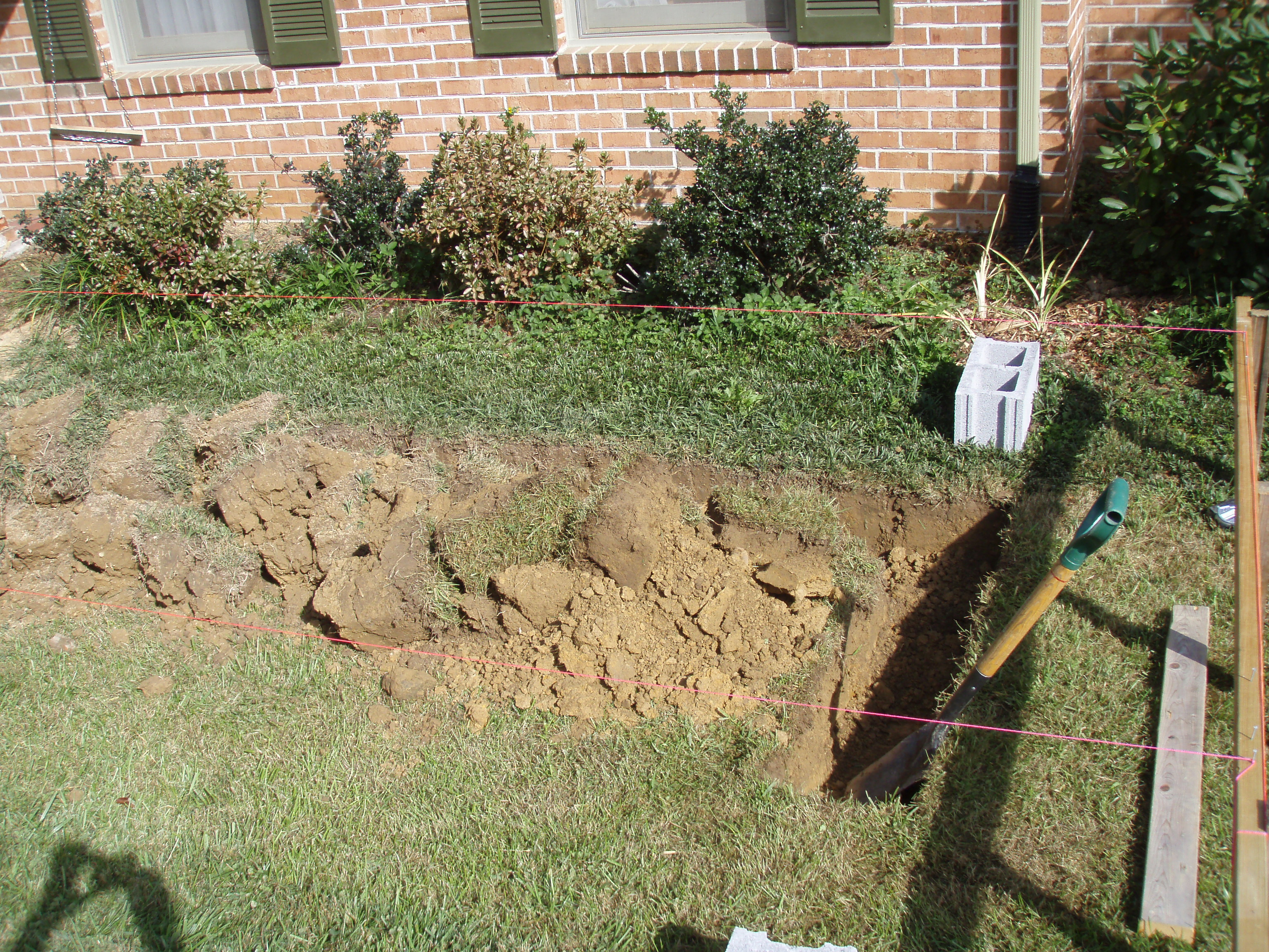 front gable porch with brick raised garden