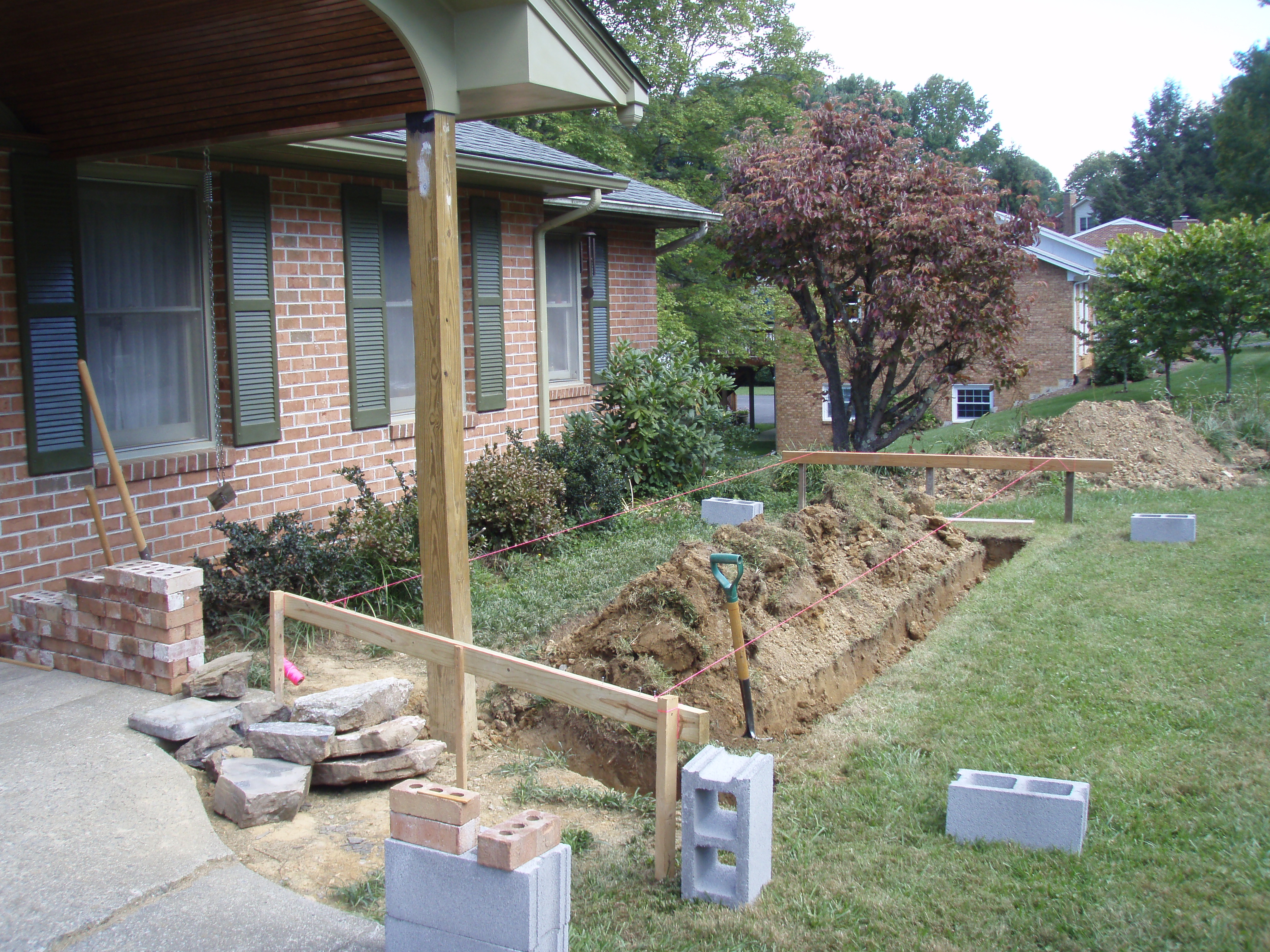 front gable porch with brick raised garden