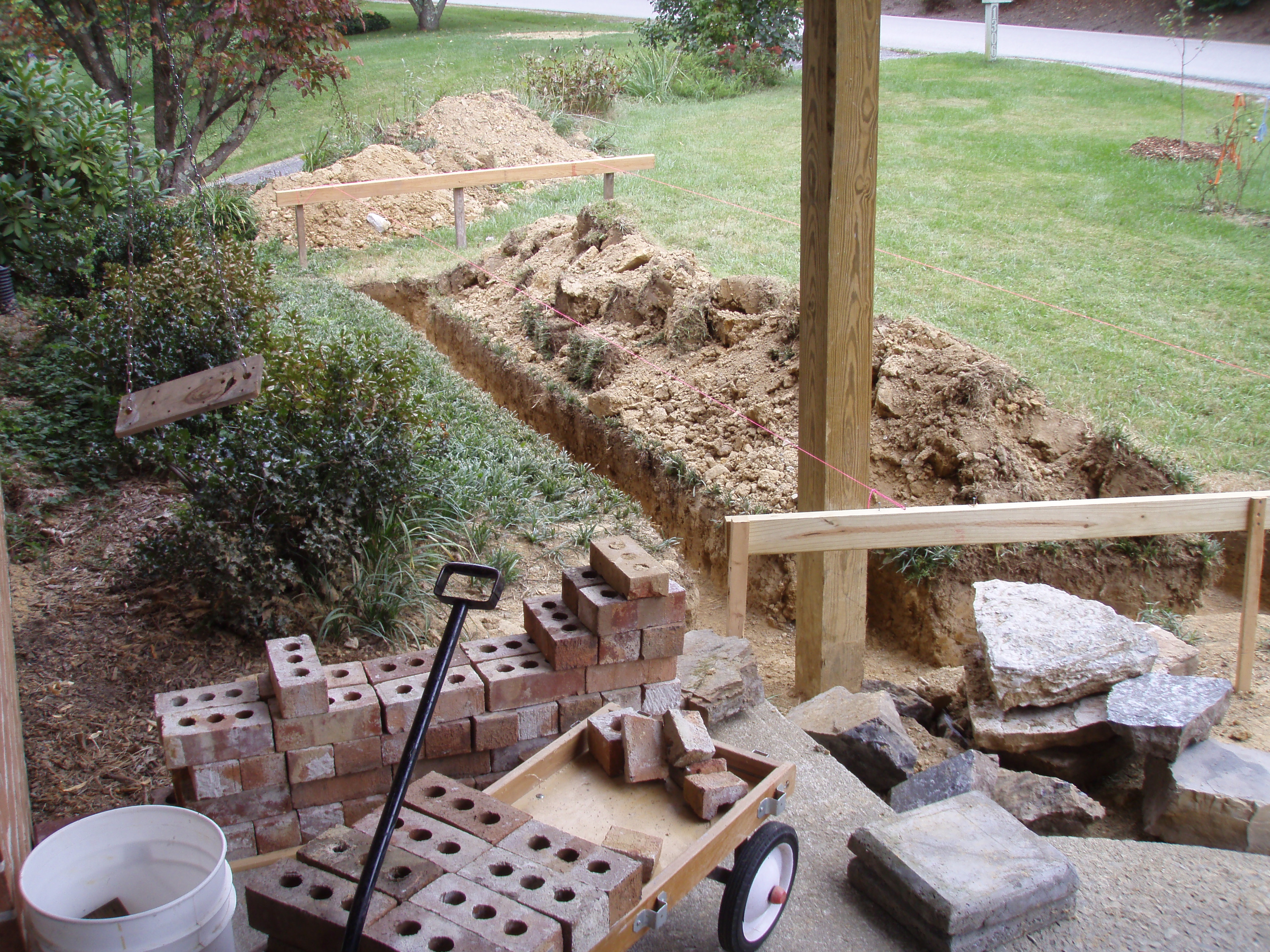 front gable porch with brick raised garden