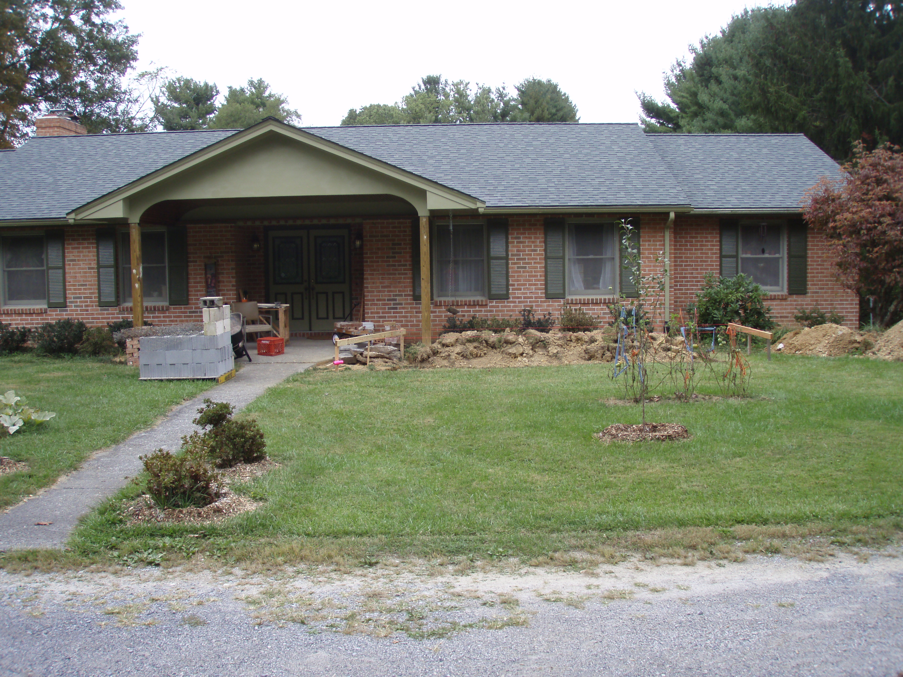 front gable porch with brick raised garden