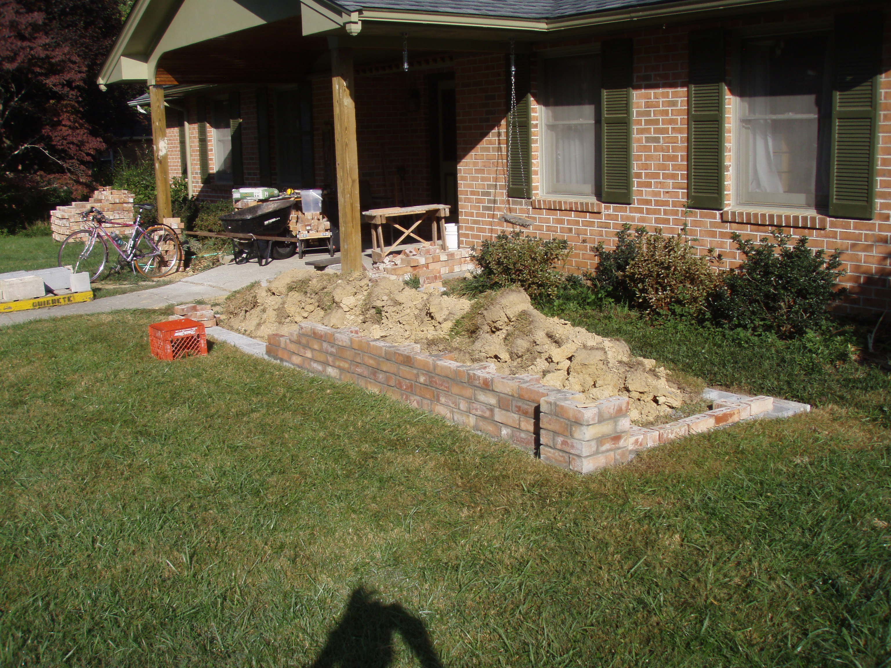 front gable porch with brick raised garden