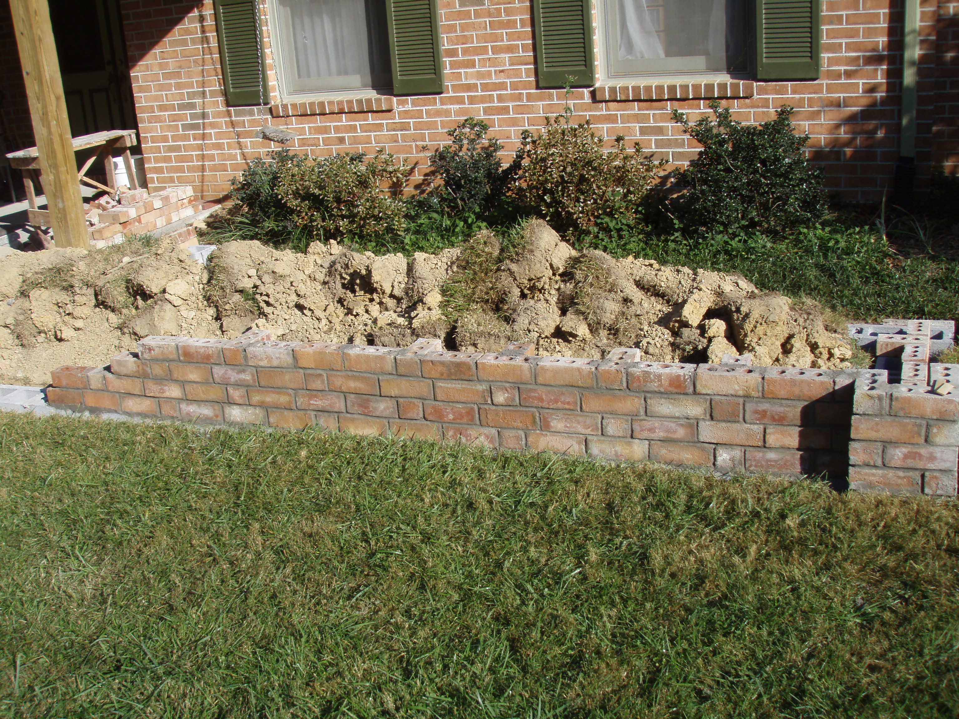 front gable porch with brick raised garden